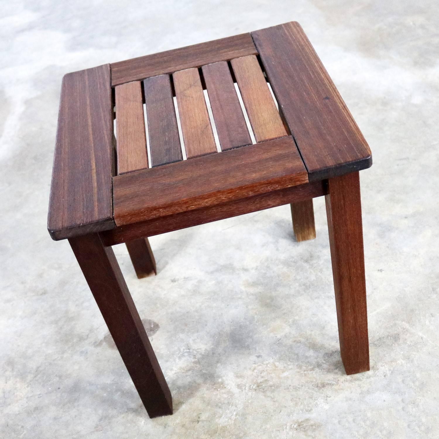 Handsome natural teak vintage windsor outdoor patio or deck side table. We have a total of 5 and are pricing them per table. These tables are in wonderful sturdy condition with the natural age patina of teak that has spent some time outside but