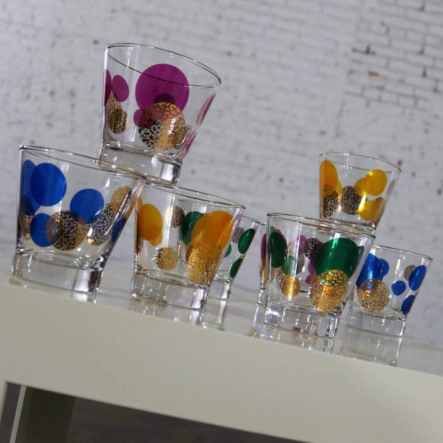 Wonderful set of eight Russel Wright designed Eclipse old fashioned cocktail glasses for Bartlett Collins. Two green, two oranges, two dark blue, and two magentas. These MCM glasses are in like-new condition with no chips, cracks, chiggers or loss