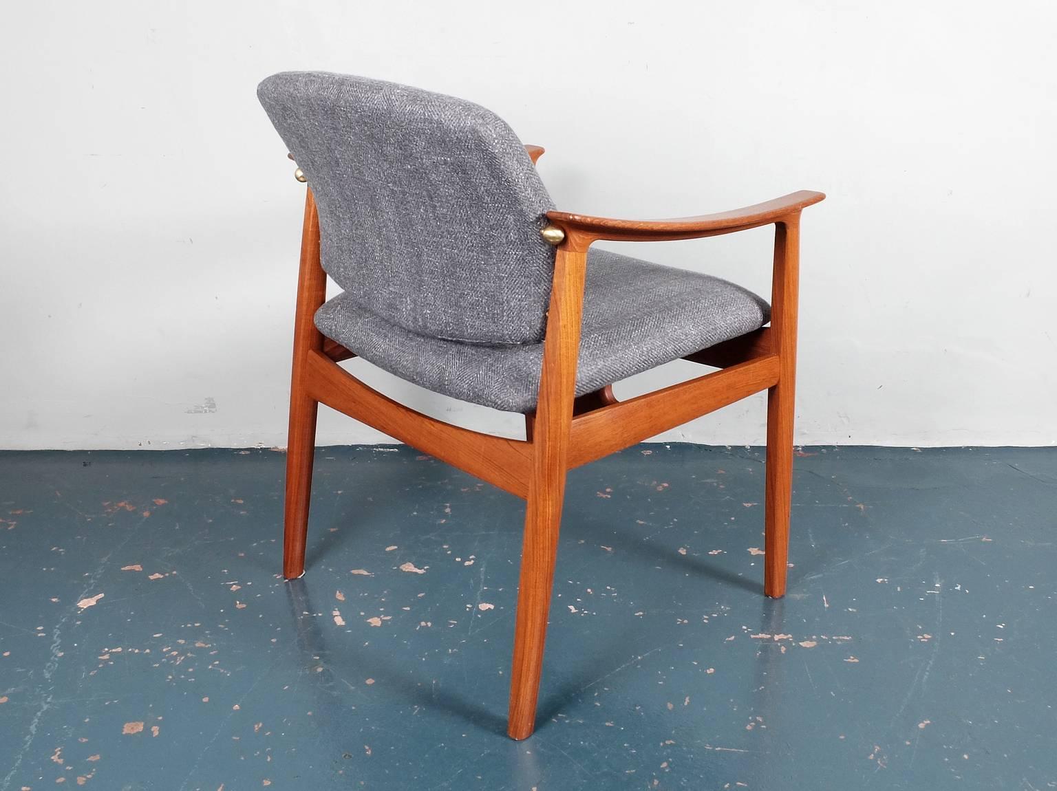 A superb quality teak framed armchair or desk chair designed by Tove and Edvard Kindt-Larsen in 1959. Manufactured by France and Son and bearing label for the period. This chair features a beautiful brass connector between the back and arm. The