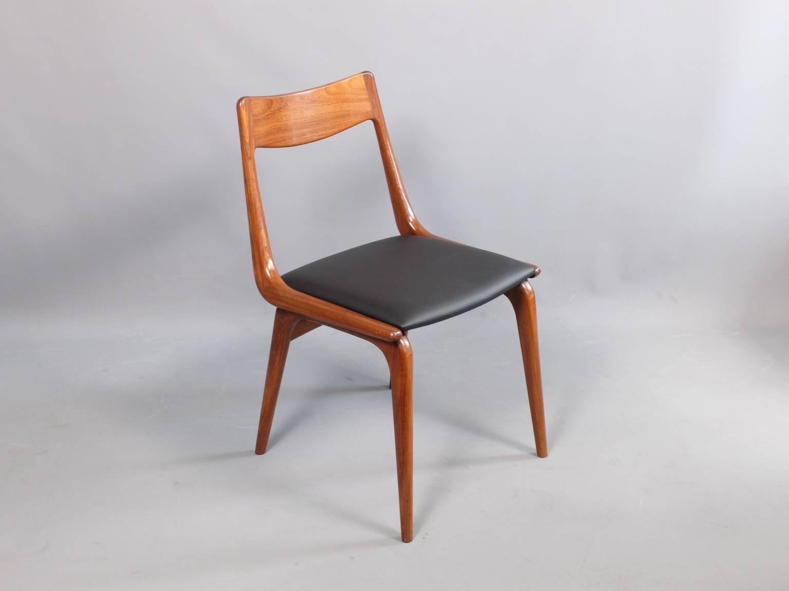 A set of six teak dining chairs designed by Erik Christensen and manufactured by Slagelse, Denmark, circa 1960. We have re-upholstered the seats with black leather.