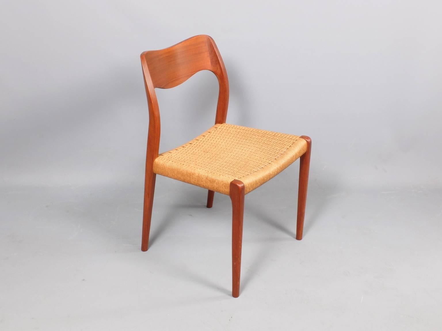 A set of six teak dining chairs designed by Niels Otto Moller and manufactured by J L Moller, Denmark, circa 1960. The chairs retain their original twisted paper cord seats.