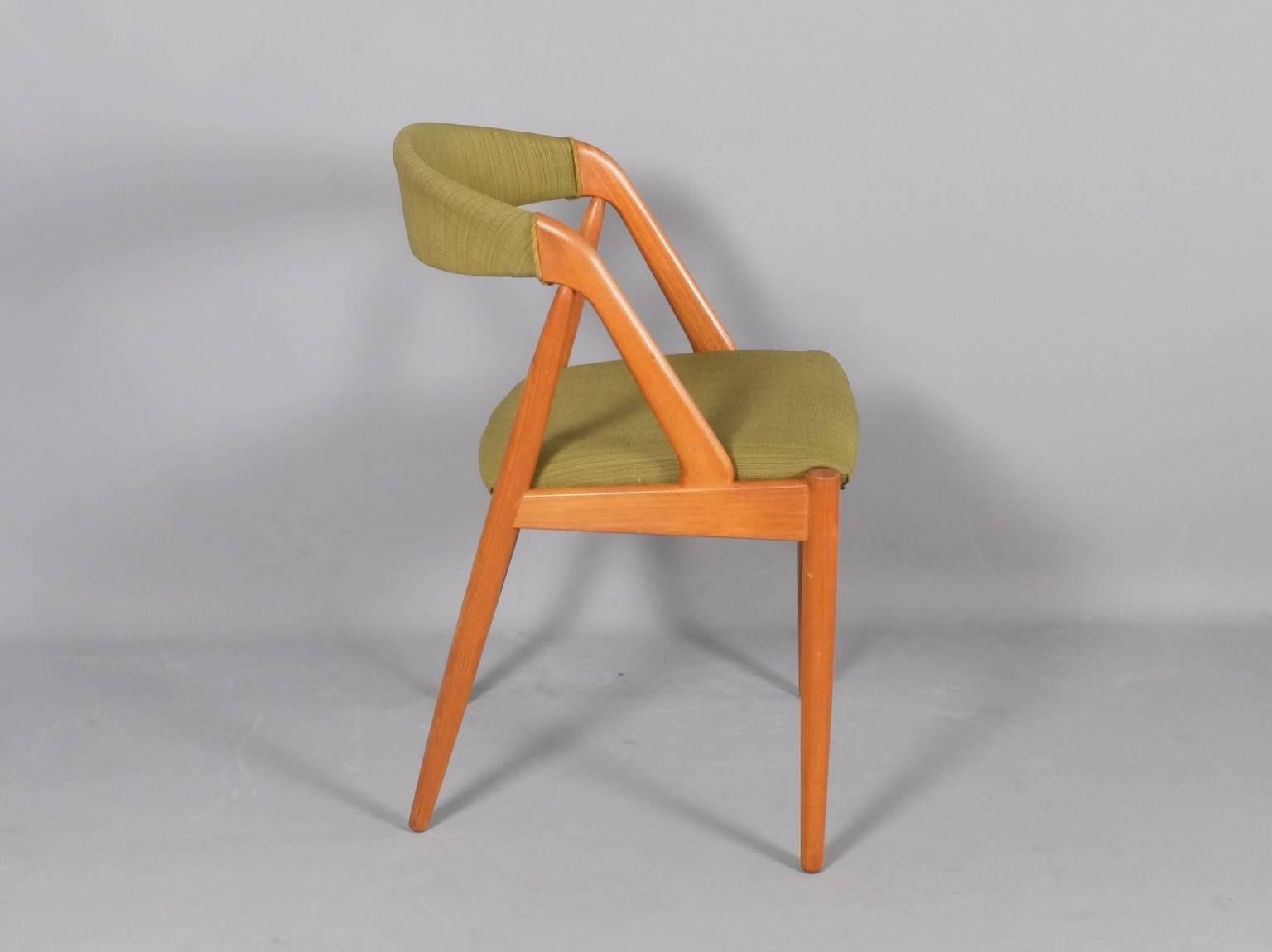 Designed by Kai Kristiansen and produced by Schou Andersen, circa 1960 these chairs are not only beautiful but very comfortable. The light teak frames have been thoroughly cleaned and waxed to bring out the rich grain of the timber. A total of up to