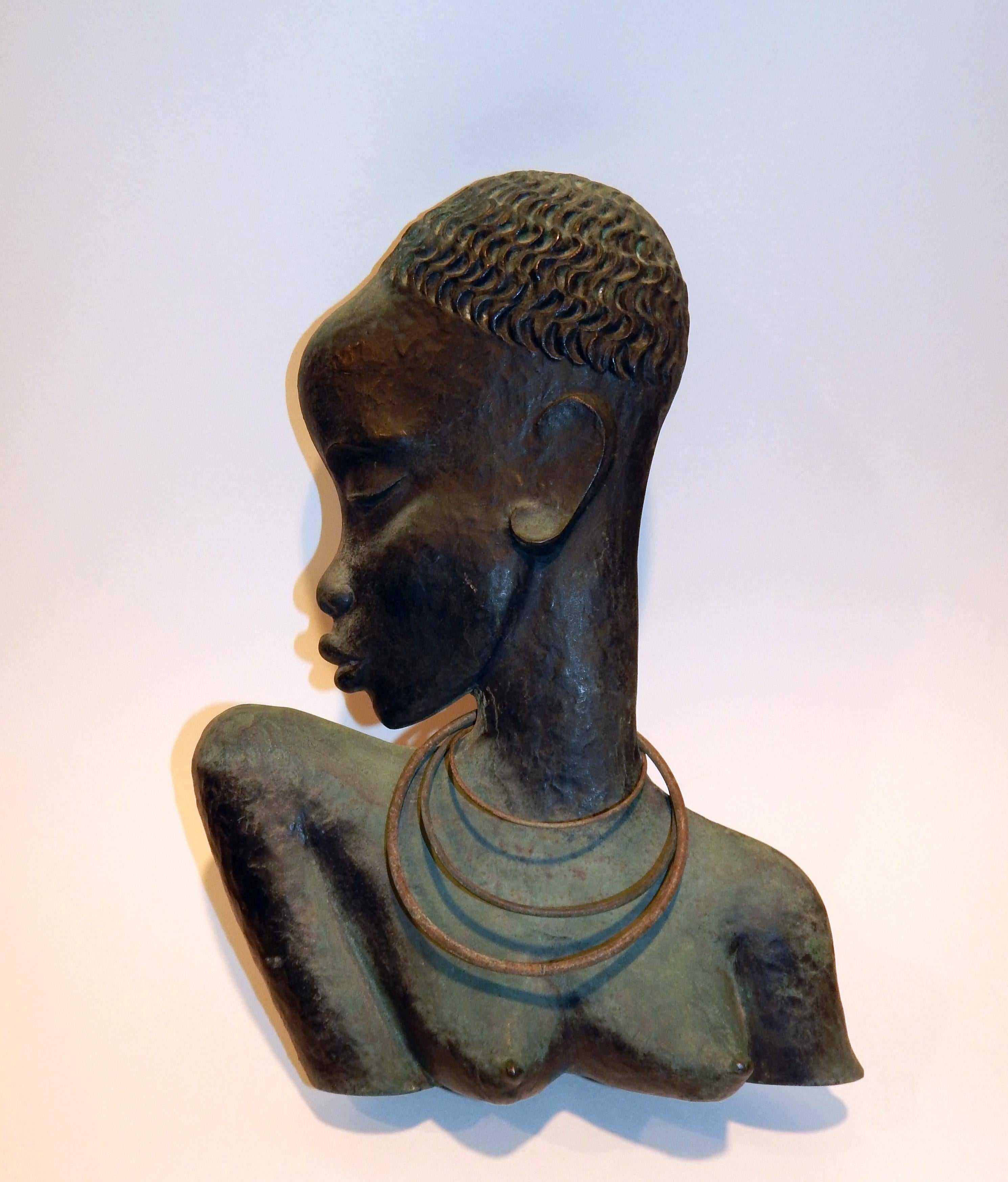 This wonderful Wiener Werkstatte bronze by Hagenauer depicts
the bust of an African Female.
It measures 14.5" H x 10" W x 3" D and bears the rare "Rena" mark.
This piece was made to be sold out of Rena Rosenthal's