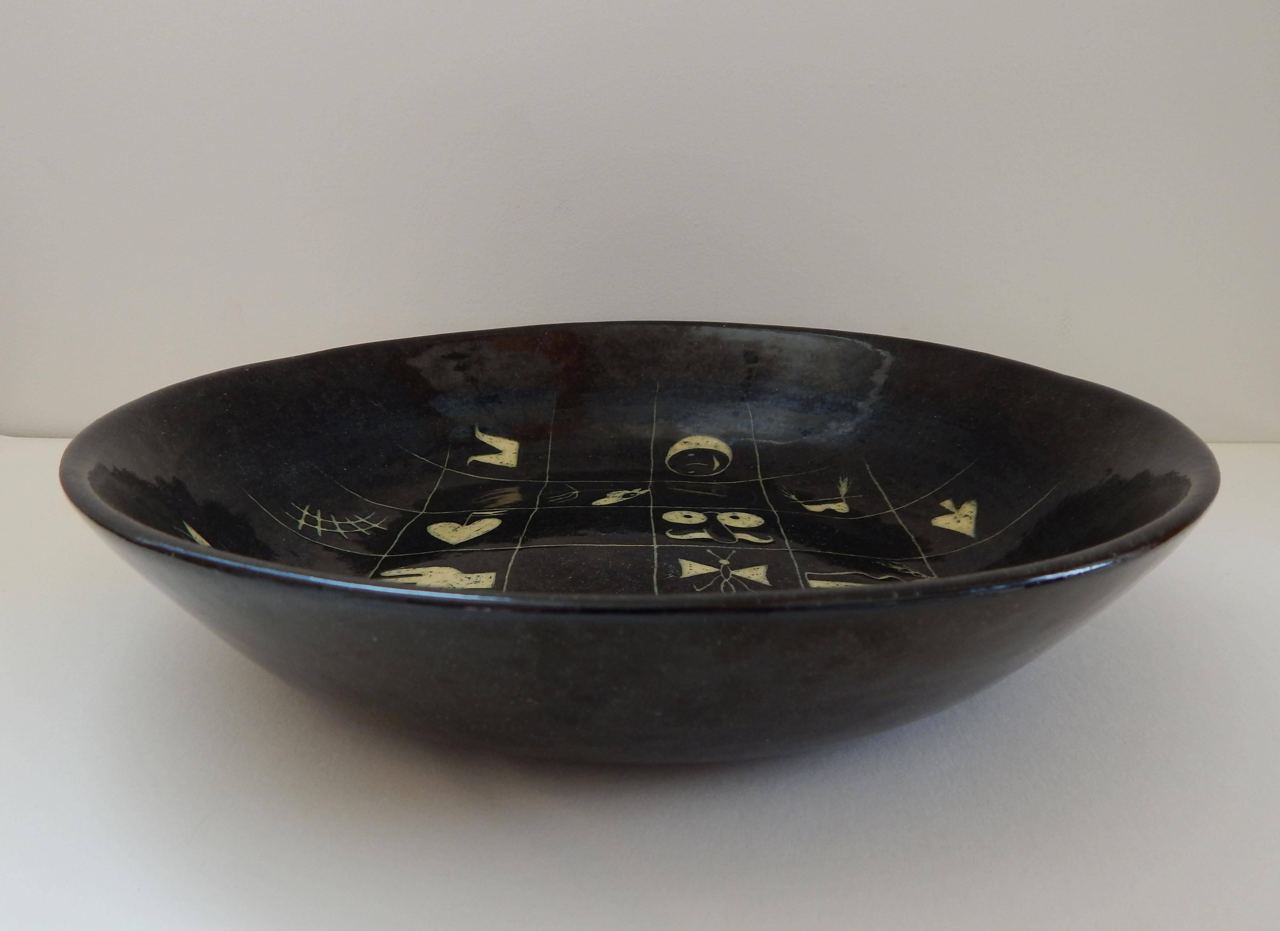 Studio Art Pottery piece in black with whimsical checkerboard design. 
Signed on the bottom: F. Bergmann with his monogram and the title “Miscellanea”,
circa 1940s. Measures: 9 1/4