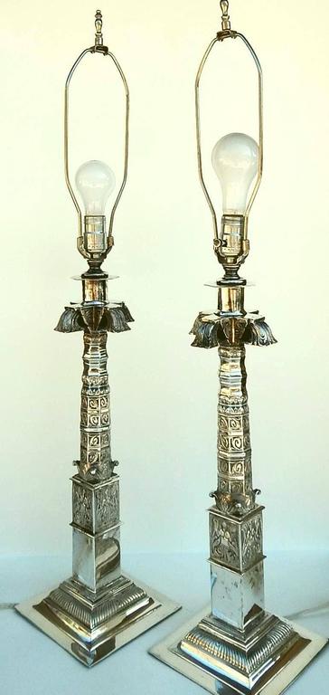 Pair of beautiful lamps.
High quality with stylized palm trees.
Touch mark visible but unknown designer.
Lamp itself is 19 ½ inches tall. The bases are 7 x 7 inches. 
Lamps are in good working condition.
 