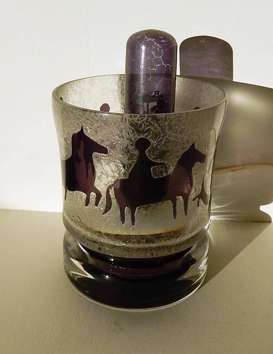 Modern Cameo glass lamp with horse and rider designs, circa 1960s-1970s.
Acid Etched finish with cut purple figures on the inside. 
Clear Glass base. Measures 7