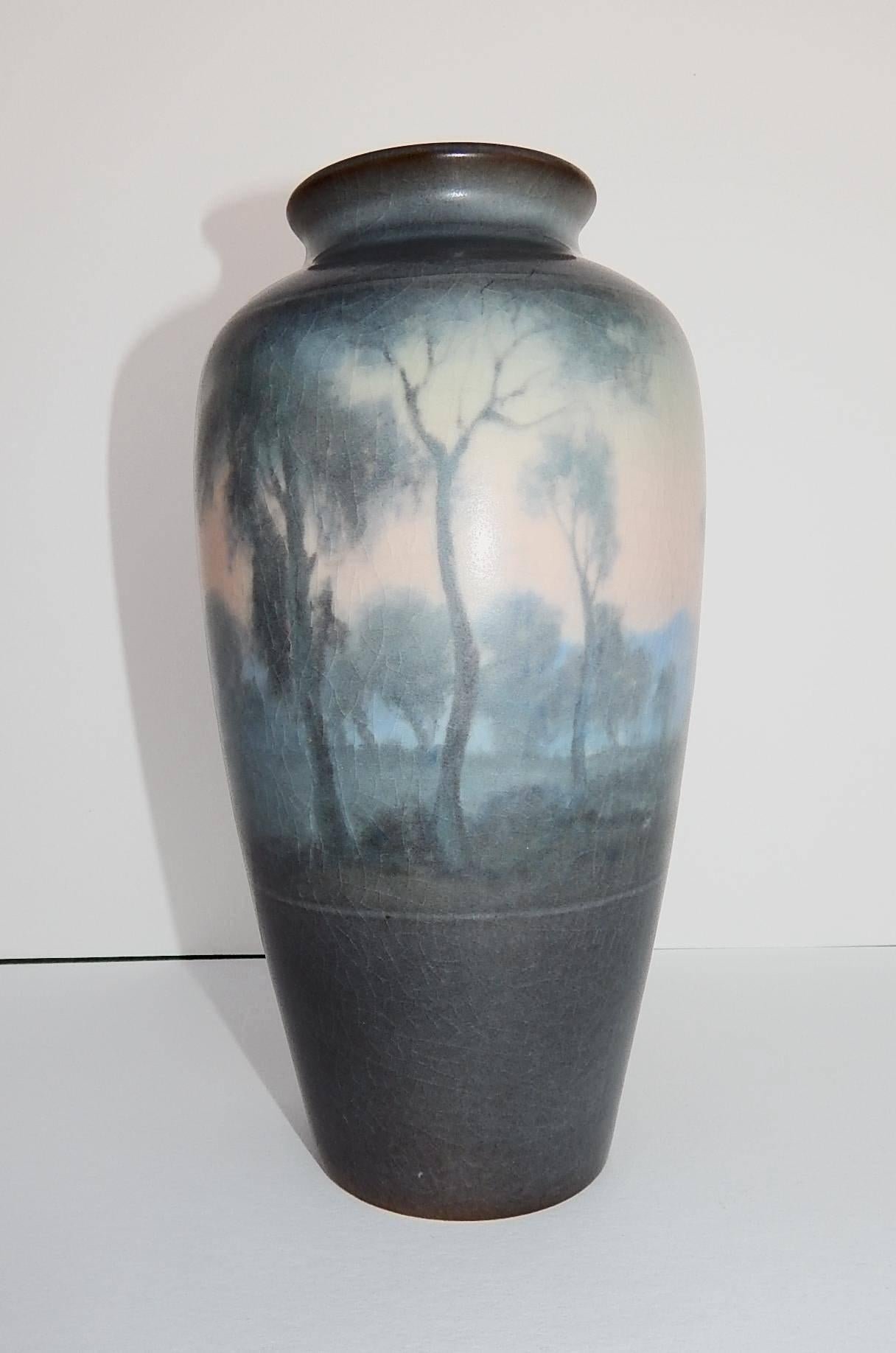 Beautiful scenic rookwood Vellum ceramic vase.
Rookwood mark, dated 1919, incised artist monogram and V for Vellum.
Artist: Fred Rothenbusch for Rookwood Pottery Company - Cincinnati, Ohio.
Mint condition; no chips, cracks or repairs. Has
