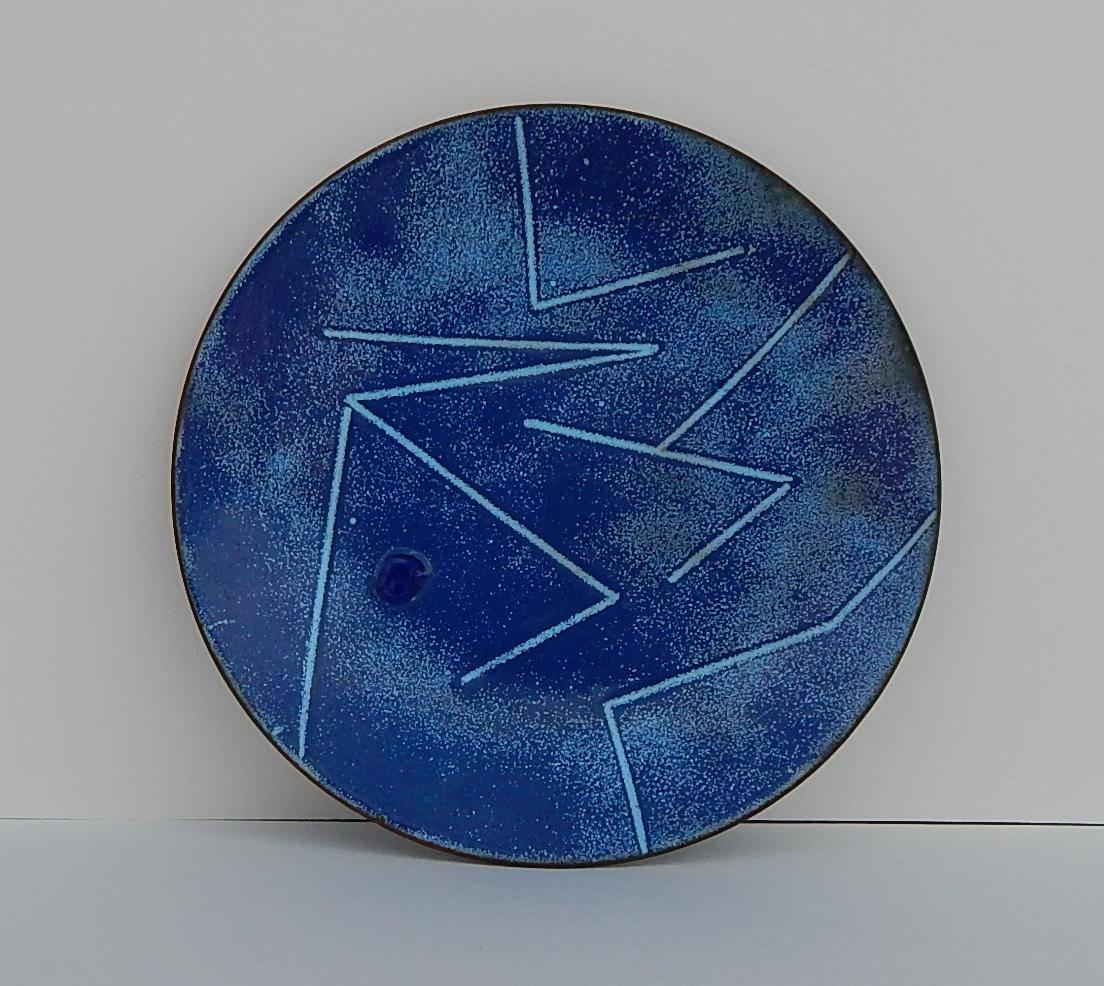 Two enamel on copper shallow trays by Edward Winter.
Abstract designs in blue.
One round with paler geometric pattern signed “Ed Winter.” 6