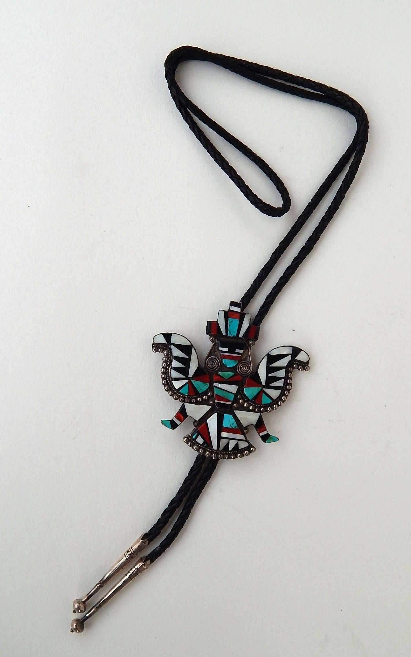 Beautiful handcrafted Zuni Bolo tie. Natural stones set in sterling.
No mark is seen, circa 1940s.
Black leather tie is included with sterling tips.
This expertly crafted Zuni piece shows beautiful craftsmanship.
The stone to stone construction