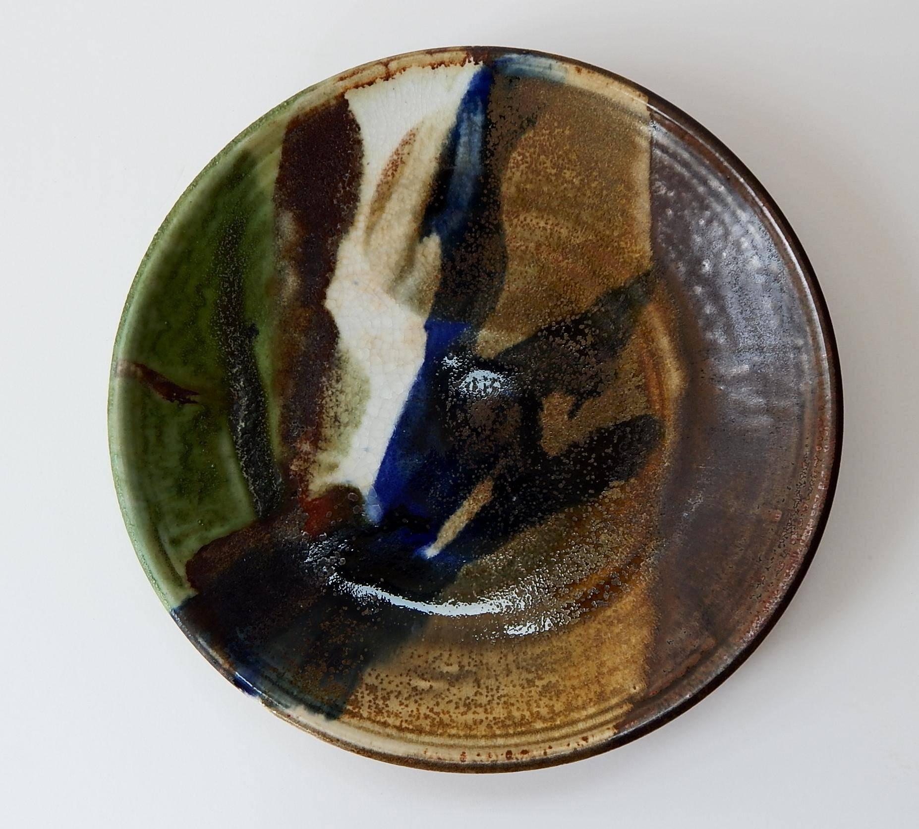 Excellent piece by Takaezu in mint condition, great color.
11 1/4 inches in diameter.
Signed with her TT monogram.

Toshiko Takaezu (1922-2011), a Japanese-American ceramist who helped elevate ceramics from the production of functional vessels