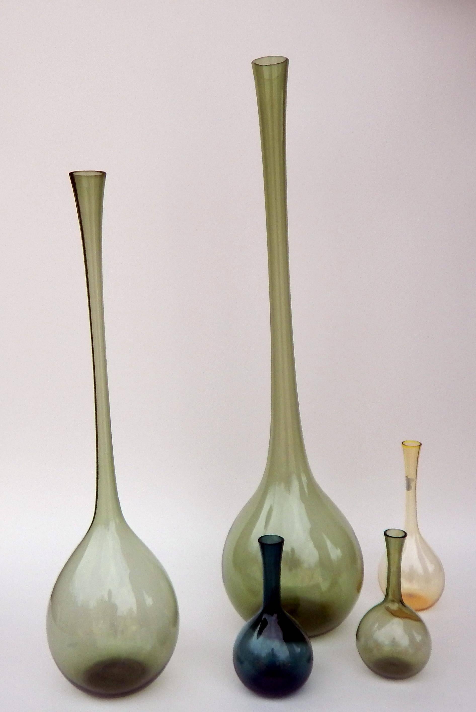 Set of various sized Swedish glass bottles made by Gullaskruf.
Designed by Arthur Percy.

The bottles measure largest to smallest:
21