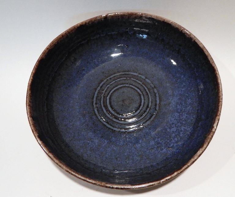 A beautiful art pottery bowl with pale exterior and bright blue interior.
Rich creamy outside glaze with exterior Sgraffito decoration.
Created by Bauhaus trained German potter and sculptor 
Frans Wildenhein (1905-1980).
Husband of well known