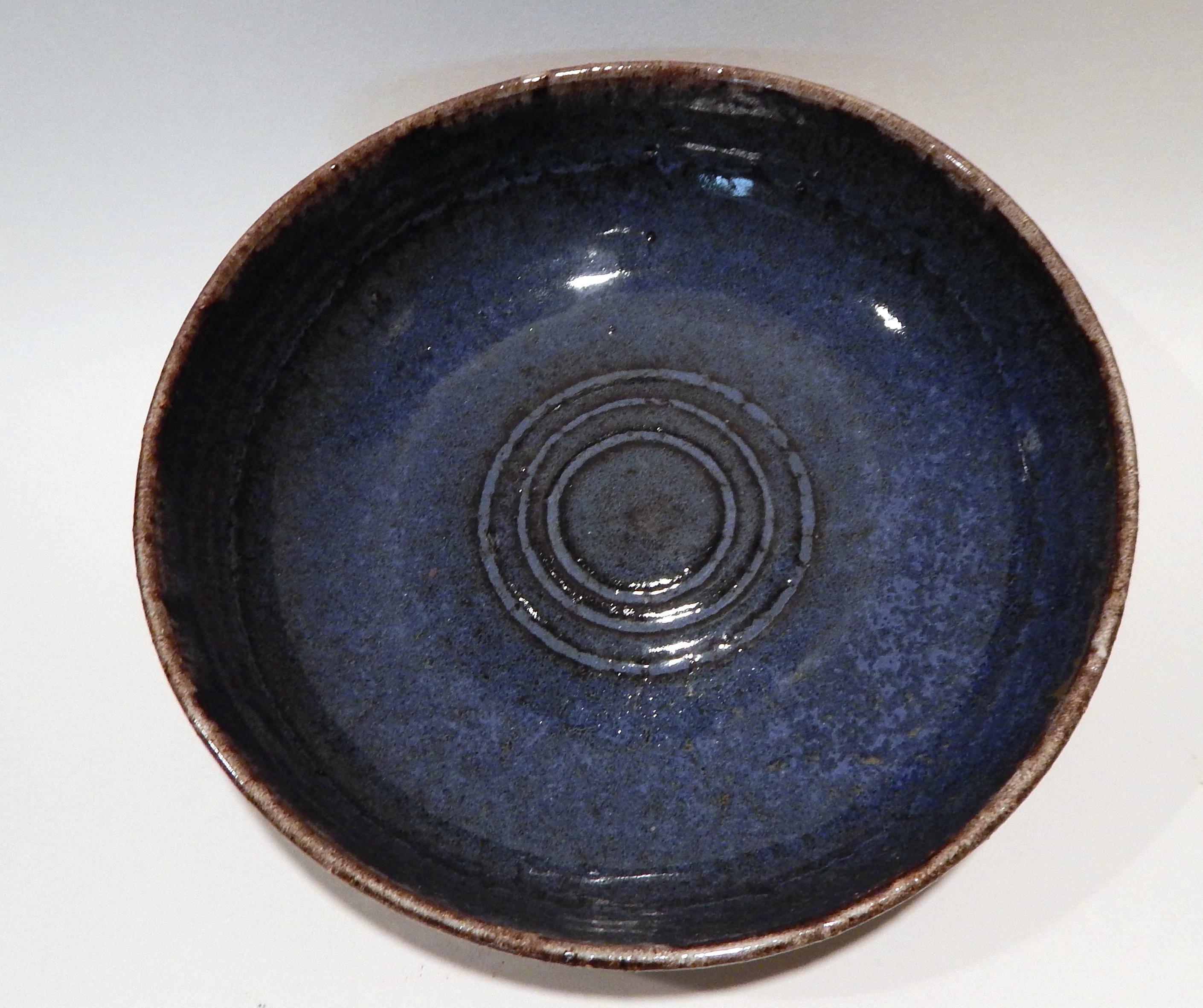 A beautiful art pottery bowl with pale exterior and bright blue interior.
Rich creamy outside glaze with exterior Sgraffito decoration.
Created by Bauhaus trained German potter and sculptor 
Frans Wildenhein (1905-1980).
Husband of well known