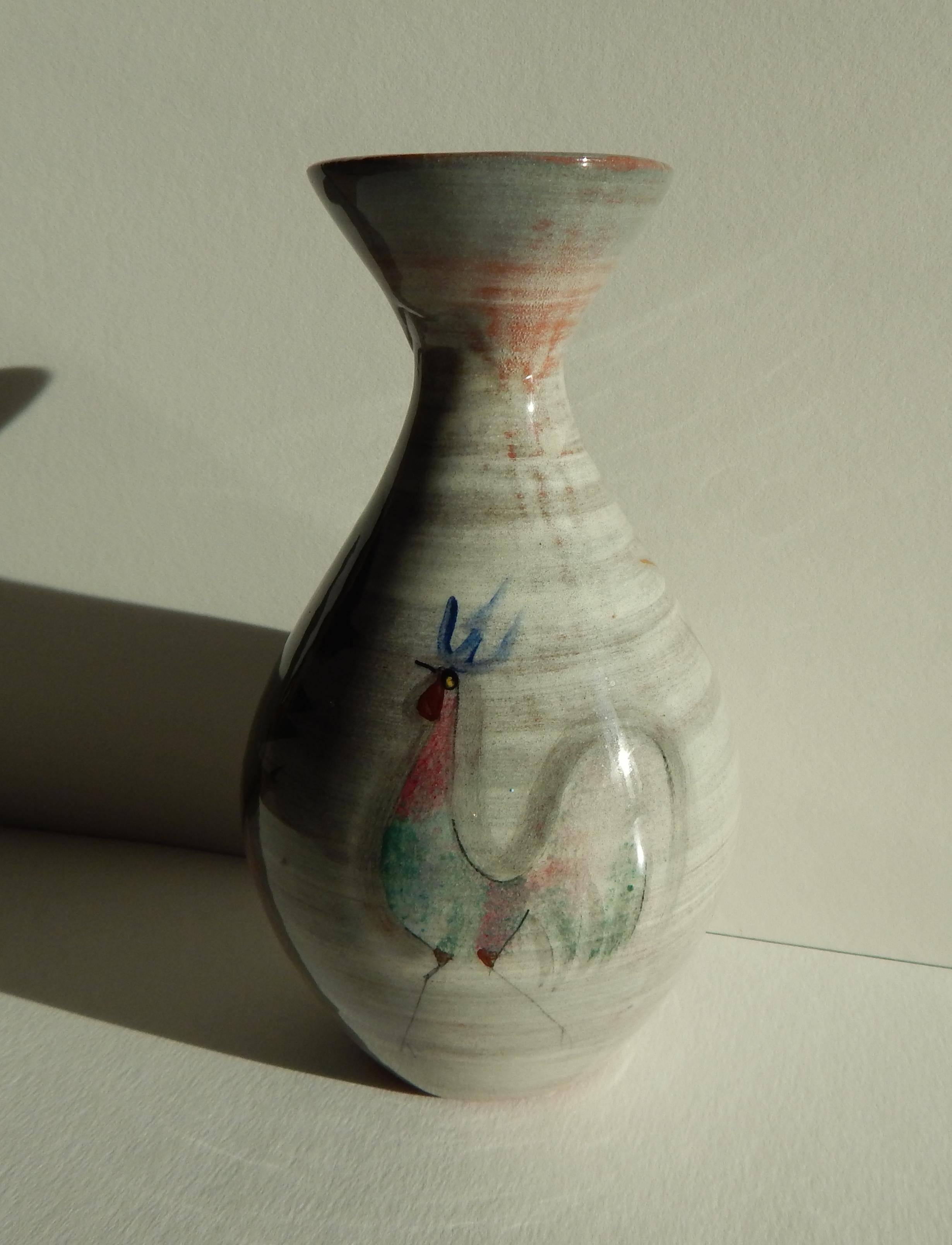 Decorated ceramic vase by Polia Pillin (1909-1992).
Pillin is known for her whimsical designs and re-occurring motifs of
women, birds, horses and flowers.
This vase encompasses several of these.
Signed on the bottom: Pillin.
Perfect condition,