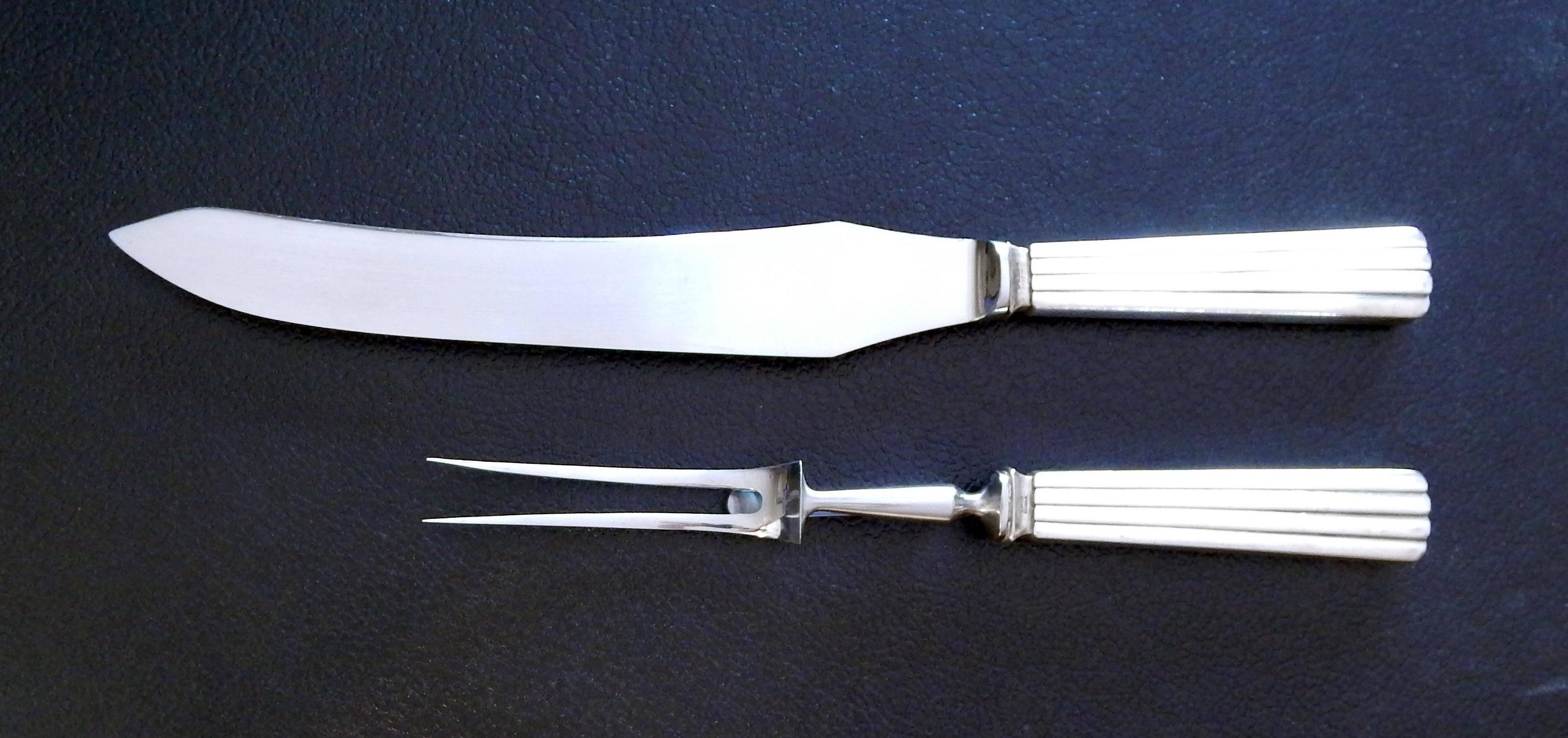 Georg Jensen sterling carving set, large, Bernadotte pattern.
Designed by: Sigvard Bernadotte (1907-2002) in 1939.
Sterling silver handles with stainless steel blade and tines.
In excellent vintage condition.
Marked: Sterling, Denmark, Georg