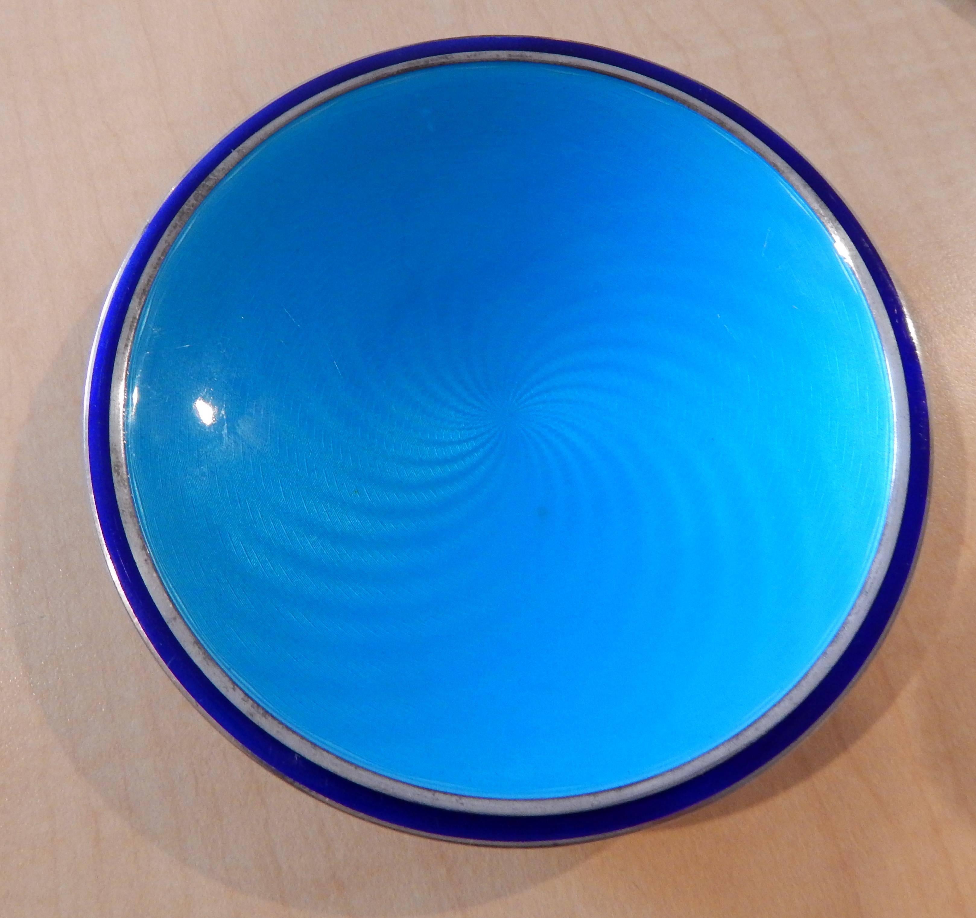 Modernist enamel tray or small plate.
Stamped on the bottom: Sterling, Norway, J. Tostrup.
Also bears two monograms. 
Beautiful shades of blue with swirl design.
Excellent condition.
Measures 3/4
