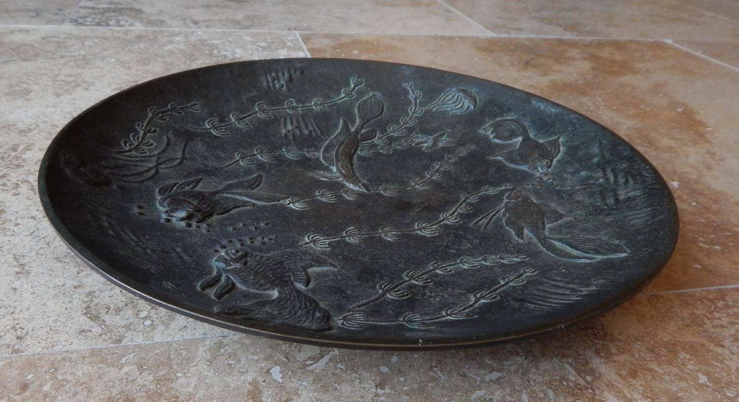 Bronze decorated plate designed by Gunnar Nylund with aquatic images.
Midcentury, Scandinavian. Produced in Sweden,
circa 1940s. Measures: 10 3/4 inches in diameter.
Initials 