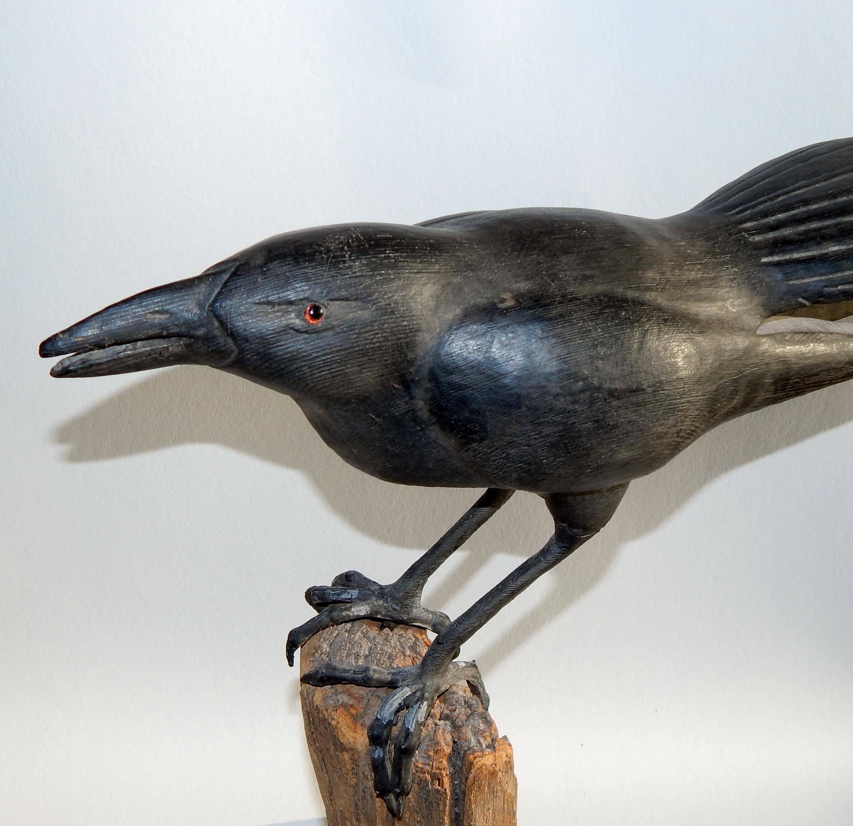 Thomas Langan (b. 1942) Folk Art raven - carved wood
Including base measures: 19 1/2