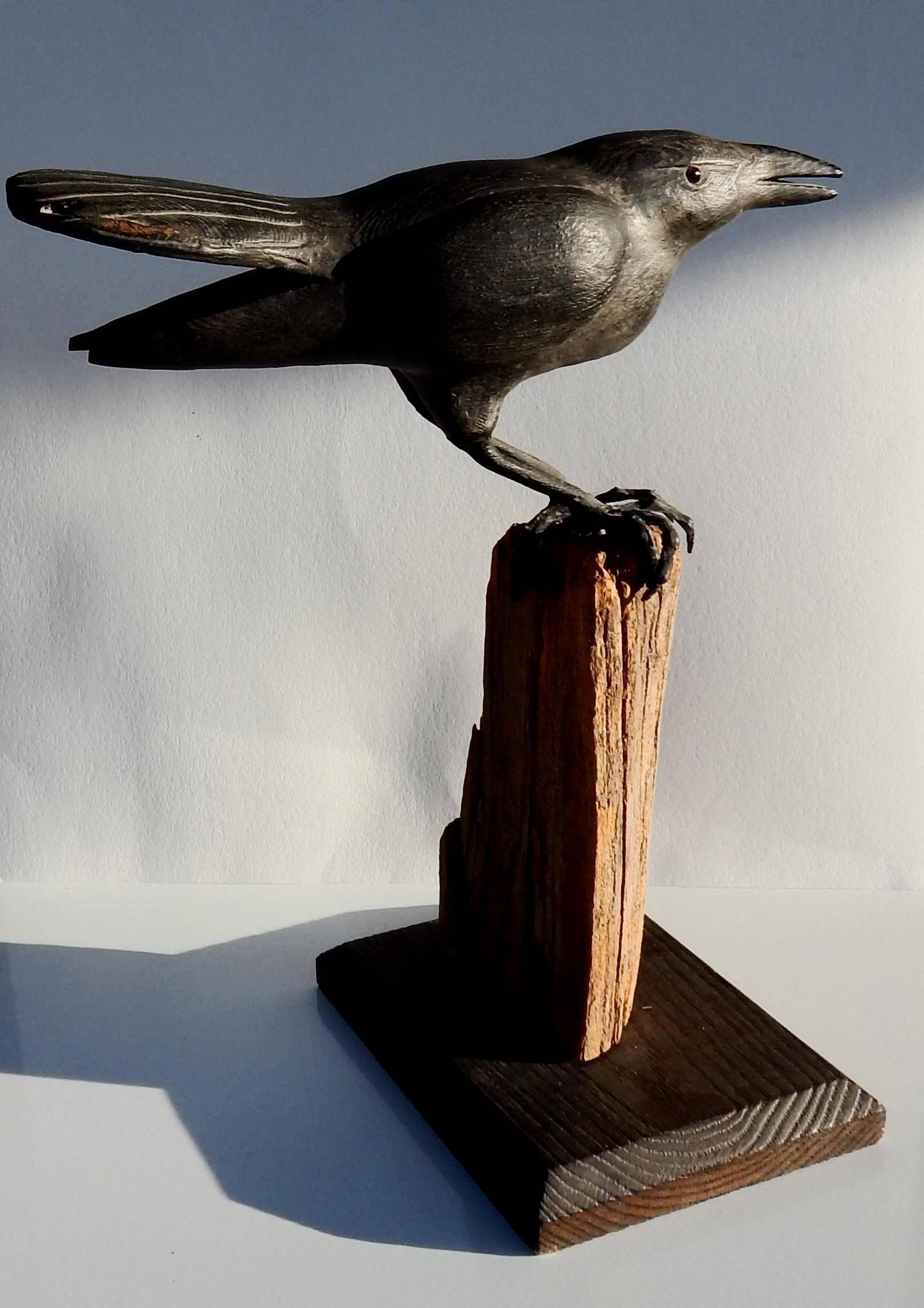 carved wood raven