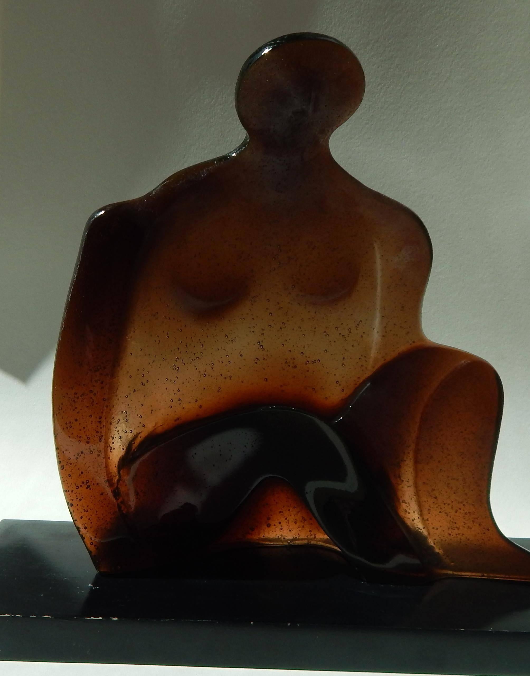 Daum glass figure in amber by Jean-Pierre Demarchi (1928-1979)
Sits on a wood base.
Signed Daum and numbered 50 of 200.
Also marked: Made in France and Demarchi.
Sculpture measures: 11 1/2