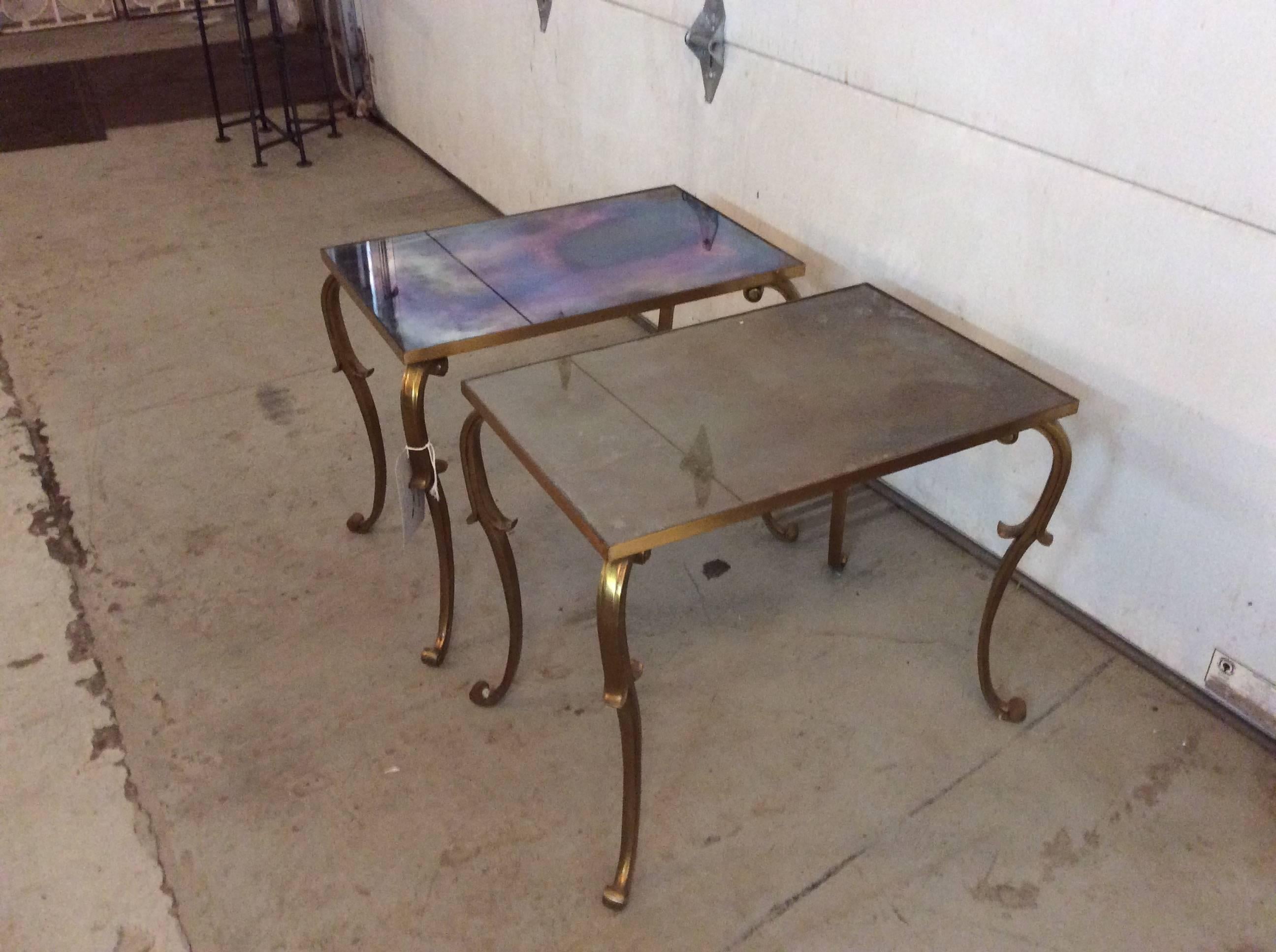 Exquisite pair of bronze side tables from France with original eglomise glass from the 1930s.