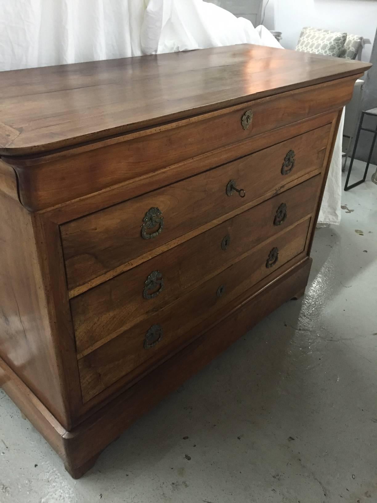 This Louis Philippe burled walnut chest is beautiful with four drawers (top drawer pulls with key). Everything is original.