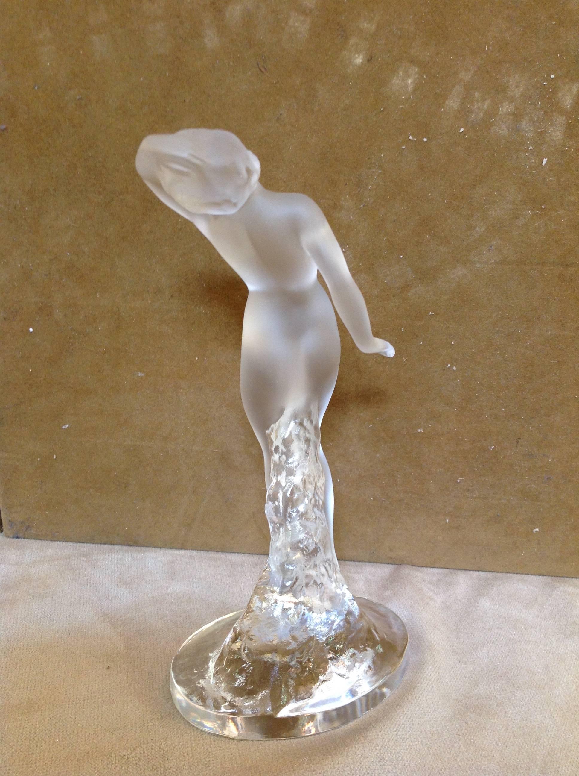 Lalique sculpture of a nude woman "Danseuse Bras Baisse" is very unique and a lovely addition to any collection.