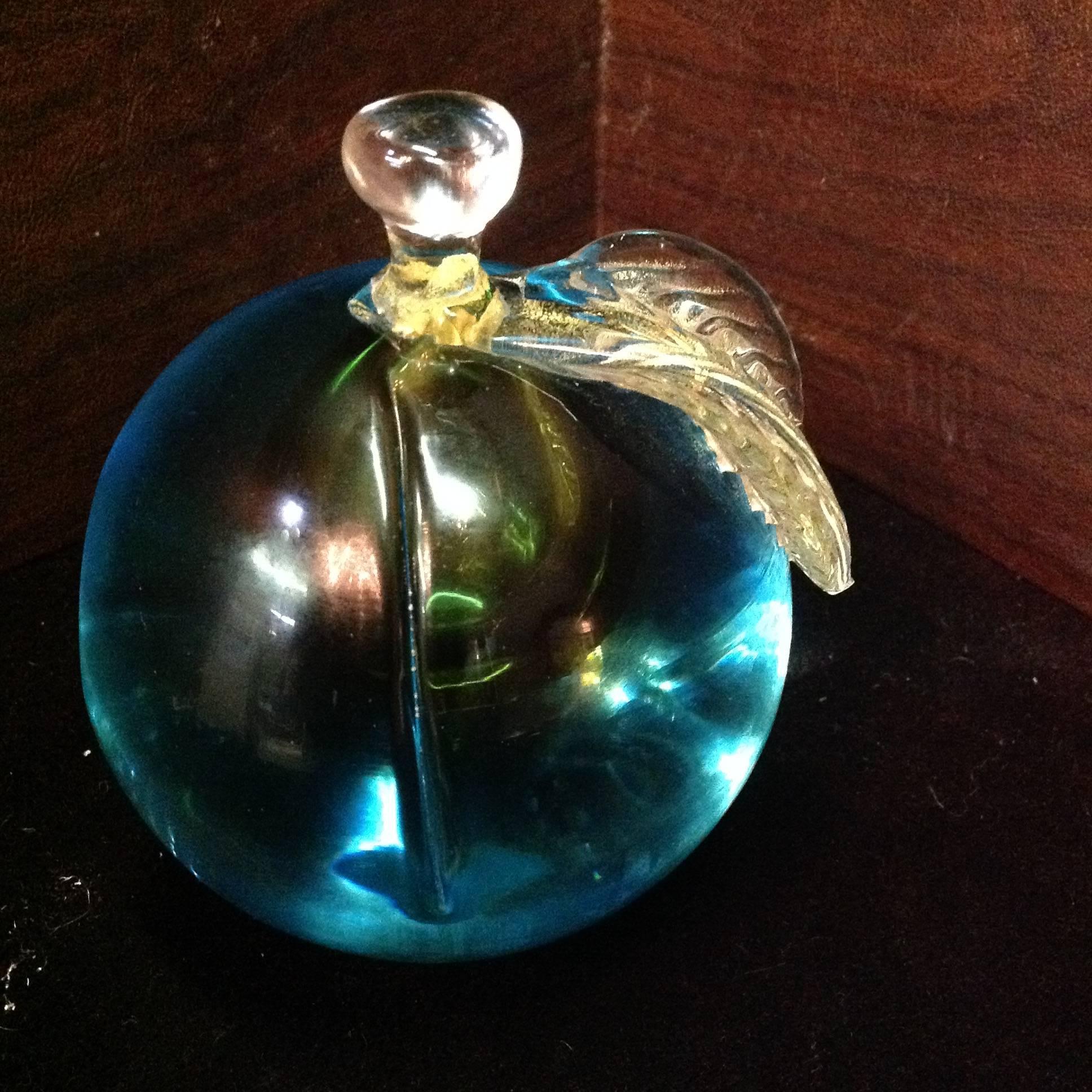 Exquisite pair of Murano bookends in gorgeous aqua blue with gold detail. Each fruit and can stand vertical or horizontal.