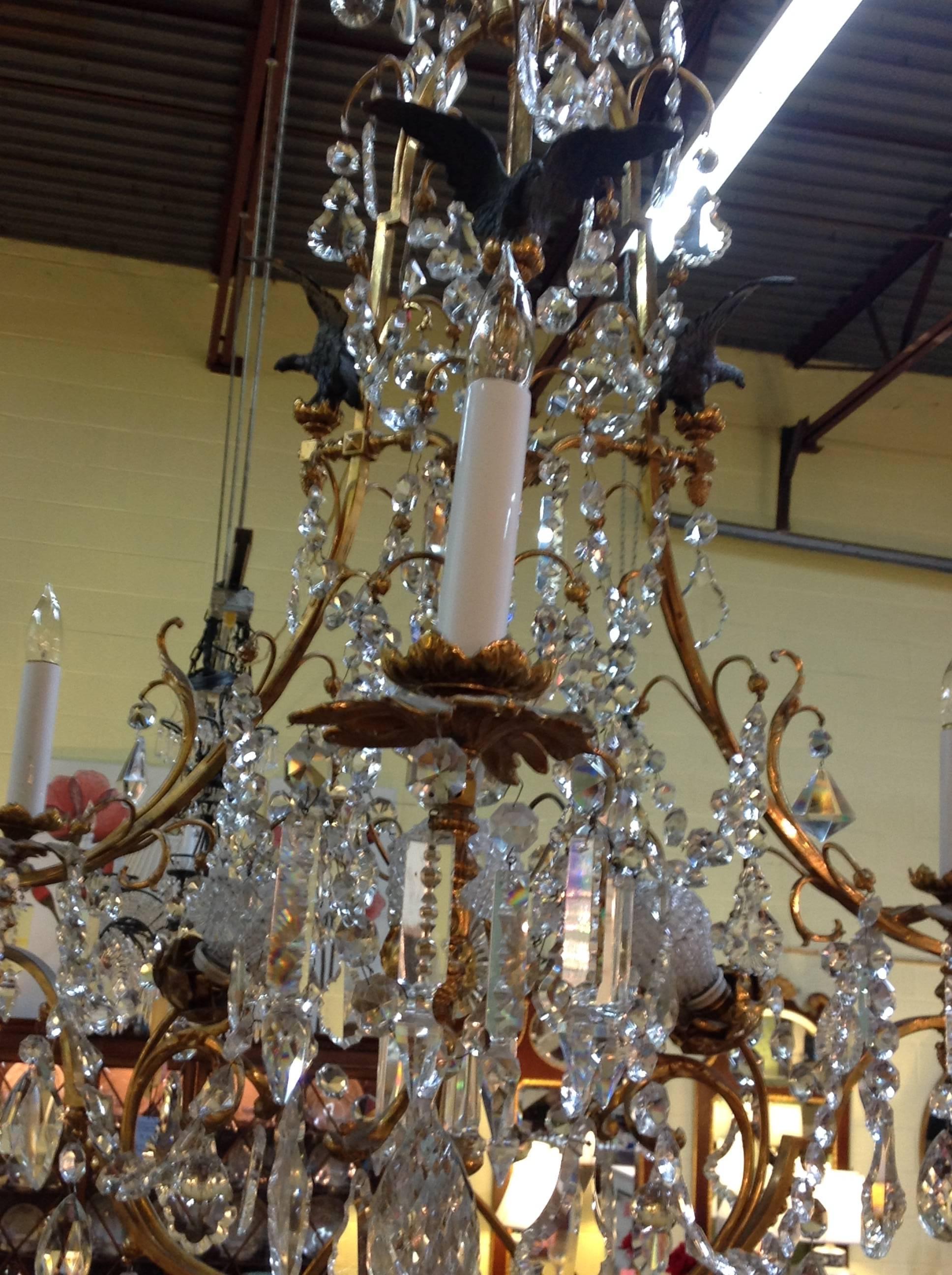 Beautiful French Empire revival crystal chandelier with metal eagles, cut crystals and Doré bronze.