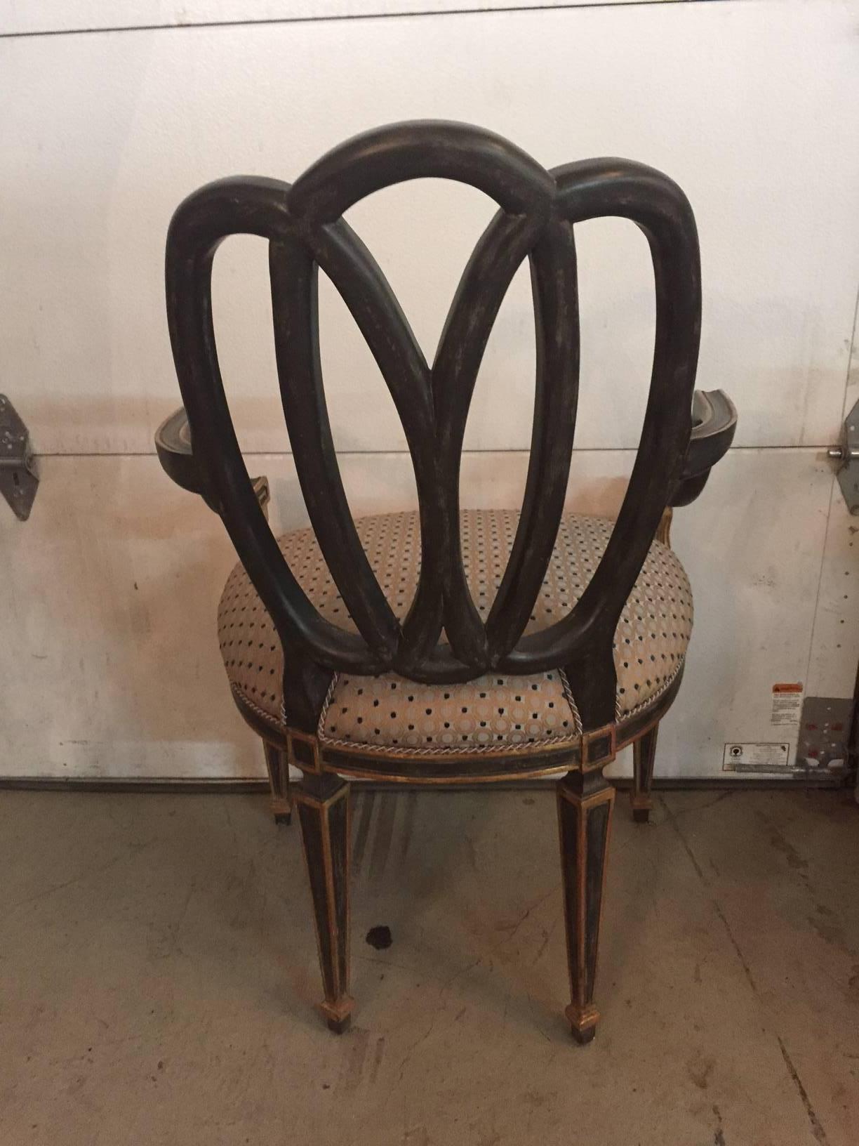 In traditional French design, this Dennis & Leen chair has a contemporary interlocking circle back painted in a charcoal black color with gilt touches and a beautiful fabric.