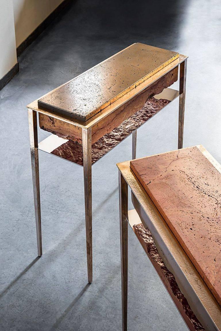 Each of these unique tables by acclaimed artist and master-craftsman, Gianluca Pacchioni, is handcrafted at the sculptor's studio in Milan. Liquid brass is poured onto raw slabs of red Persian travertine and suspended mid-air by uncannily thin legs.