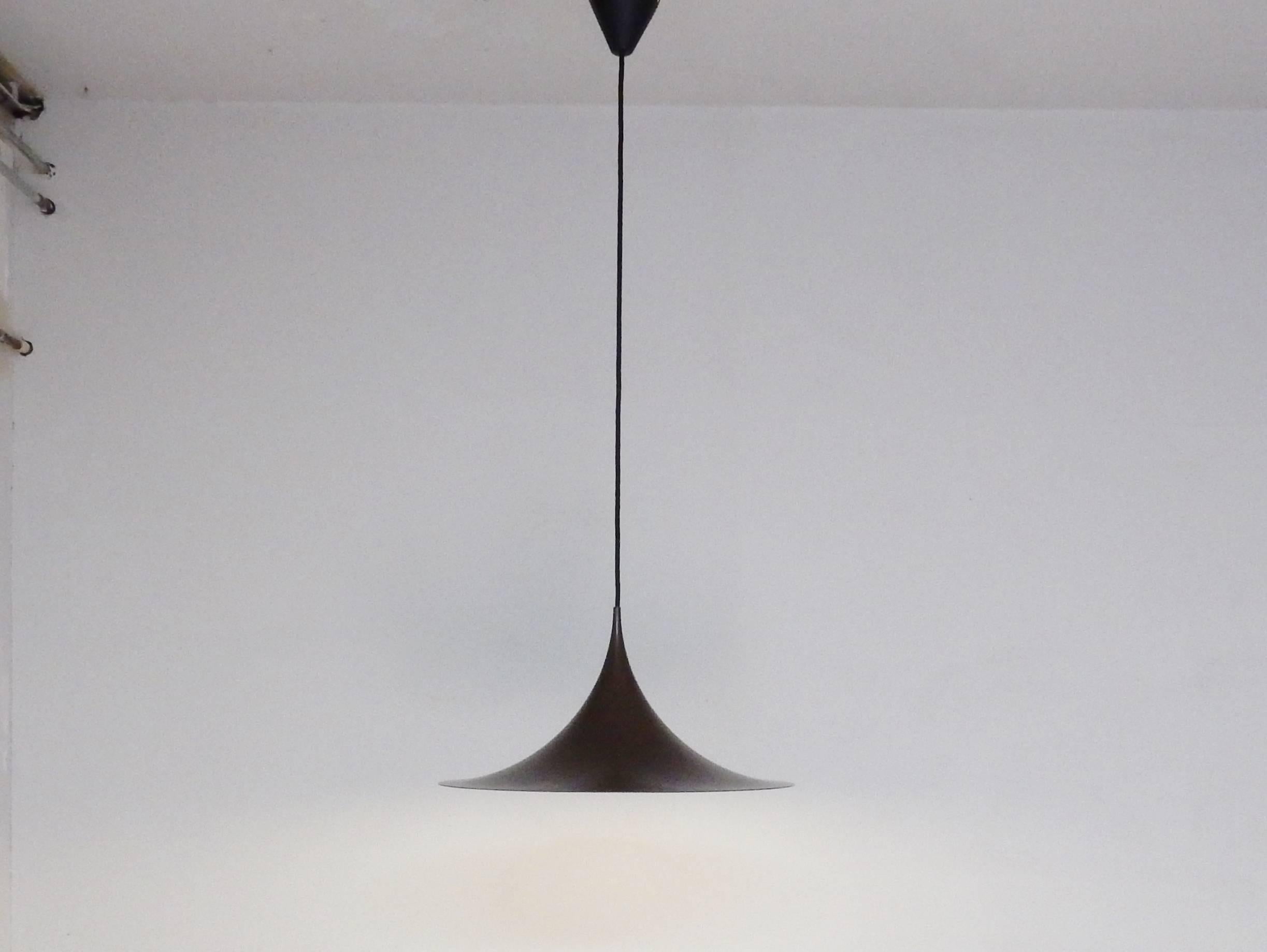 Famous model pendant lamp in brown. A design by Claus Bonderup and Thorsten Thorup. This pendant is in an excellent condition with only very minor signs of age and use.
