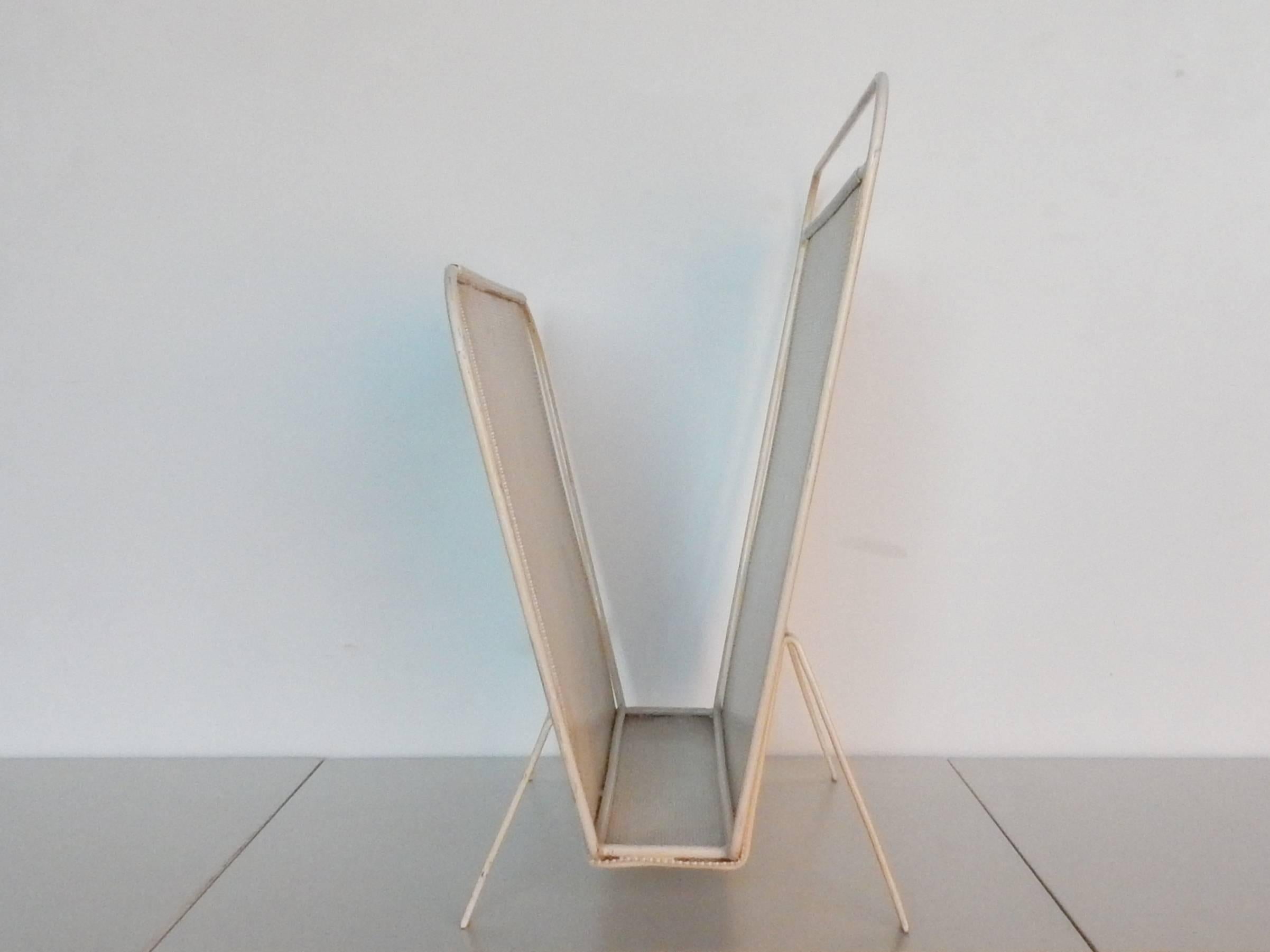 Beautiful magazine rack from mid-1950s by the company of Artimeta from Soest, The Netherlands. This design is often attributed to Mathieu Matégot who designed for Artimeta in this era. In collaboration with Floris Fiedeldij, the head designer at