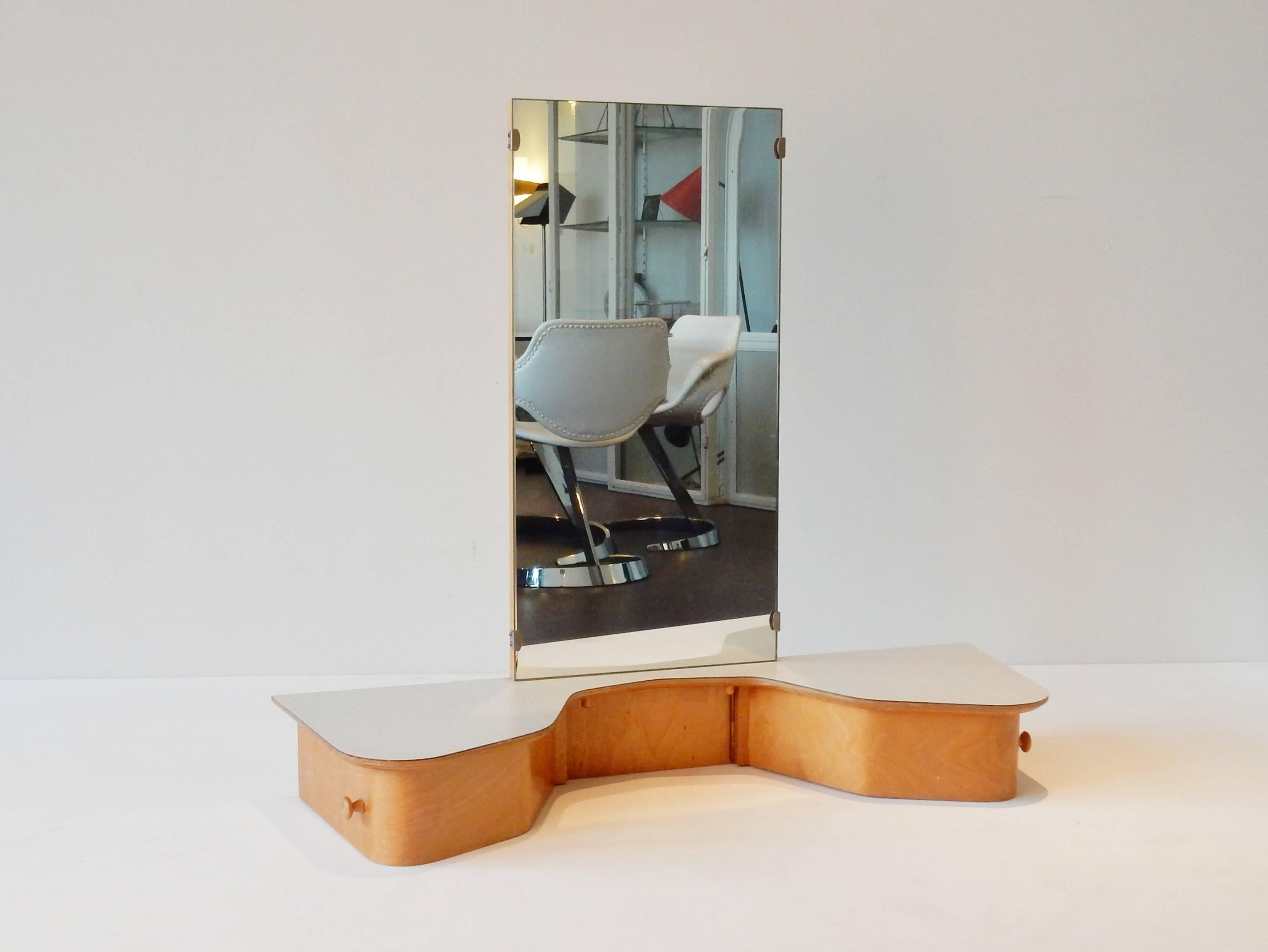 Beautiful dressing table by Cees Braakman for Pastoe. This wall-mounted item is part of the birch series and the model is EB05. This specific one is in a very nice condition. It does show some signs of age and use, mainly inside the drawers.