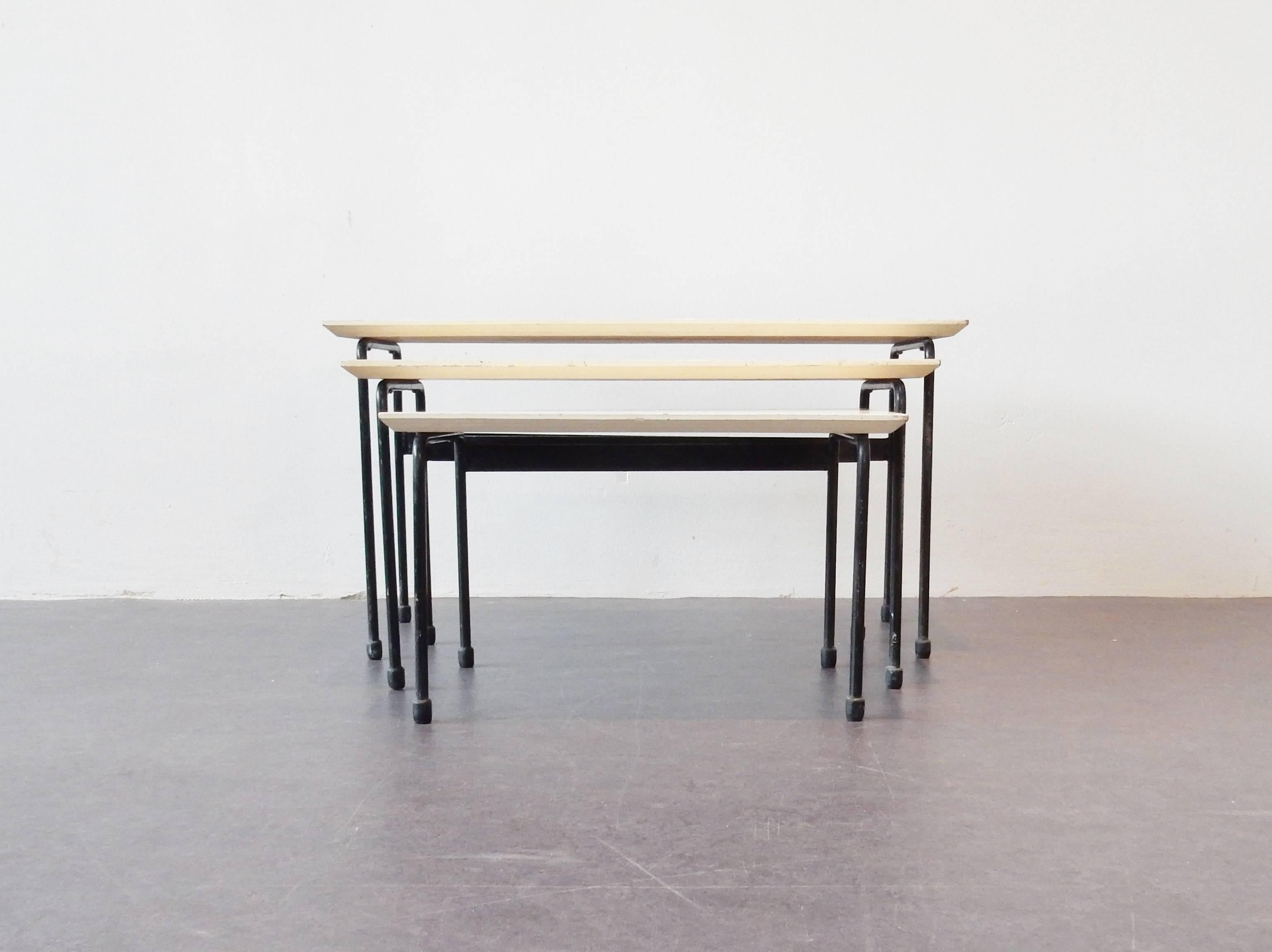 This set of three nesting tables are a design by Martin Visser for the Dutch design firm 't Spectrum. These tables have been given the name 'Twello' and were only in production for 1 year between 1956 and 1957. This complete set of three is in full