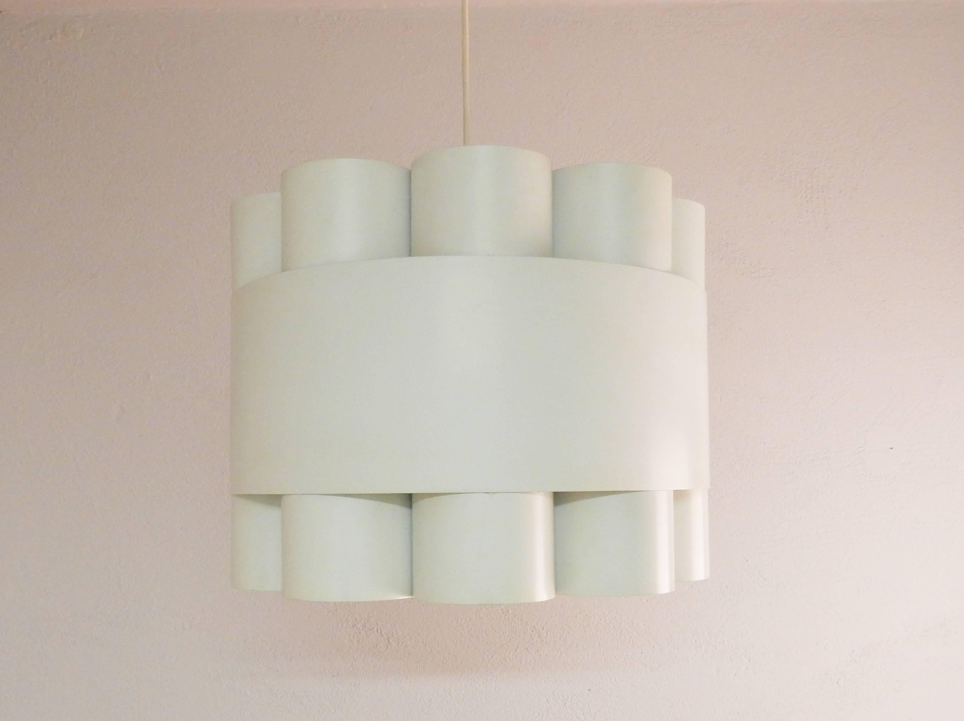 This model, 'Zero', is said to be the largest and most rare pendant by Jo Hammerborg for F&M from the 1970s. A large and heavy pendant in a composition of white lacquered metal rings held together by a large ring. A great light for a hallway or