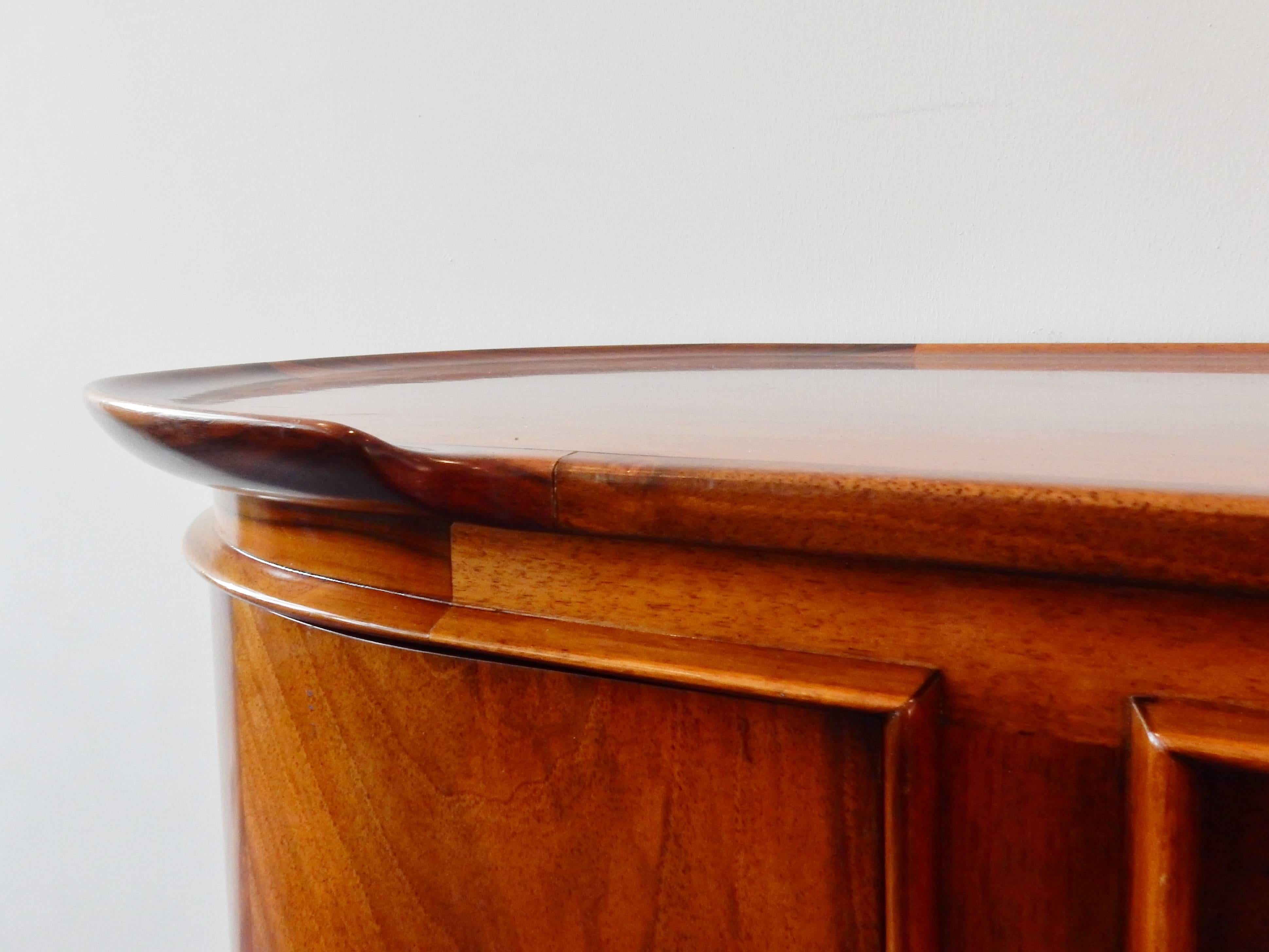 This design is very typical for A.A. Patijn. The 'dust-free' drawers for easy cleaning and the round shapes and sides are often seen in his designs. Also the upper ridge and the ridges around the doors are very typical.
This sideboard is much