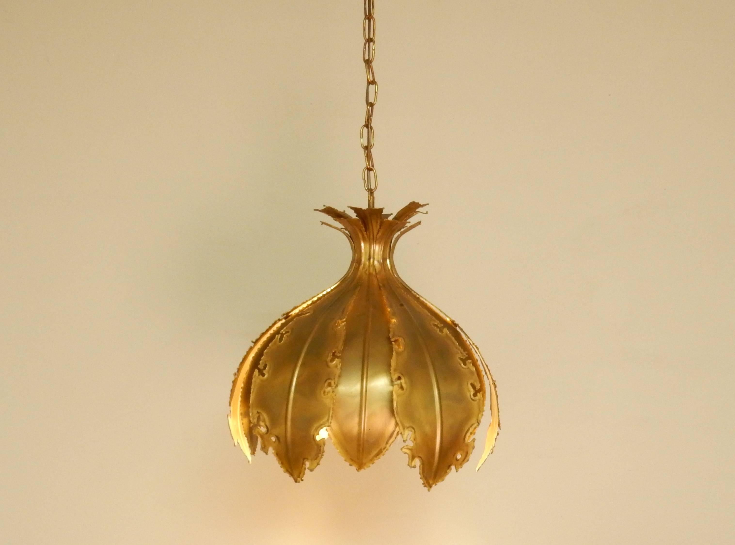 This big Brutalist pendant light has the shape of a flower, an onion or artichoke. The use and work of material makes this light an impressive item. This light comes with the original and labelled ceiling rose, as pictured.