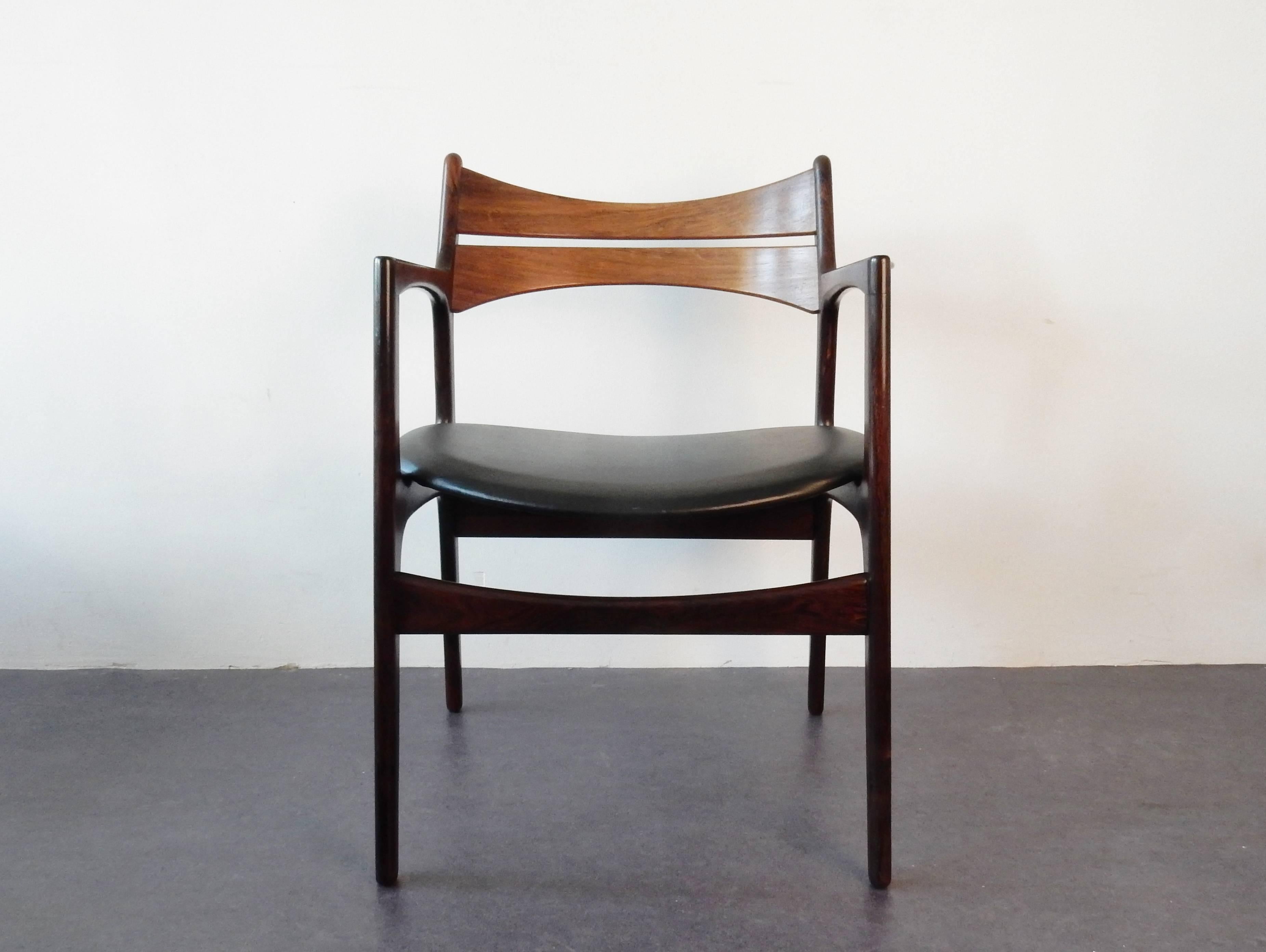 This armchair is a design by Erik Buck for Chr. Christensen Møbelfabrik i/s in Vamdrup, Denmark. A beautiful design, executed in rosewood with leatherette seat. The design has the signature of Erik Buck all over as it is very recognizable. The chair