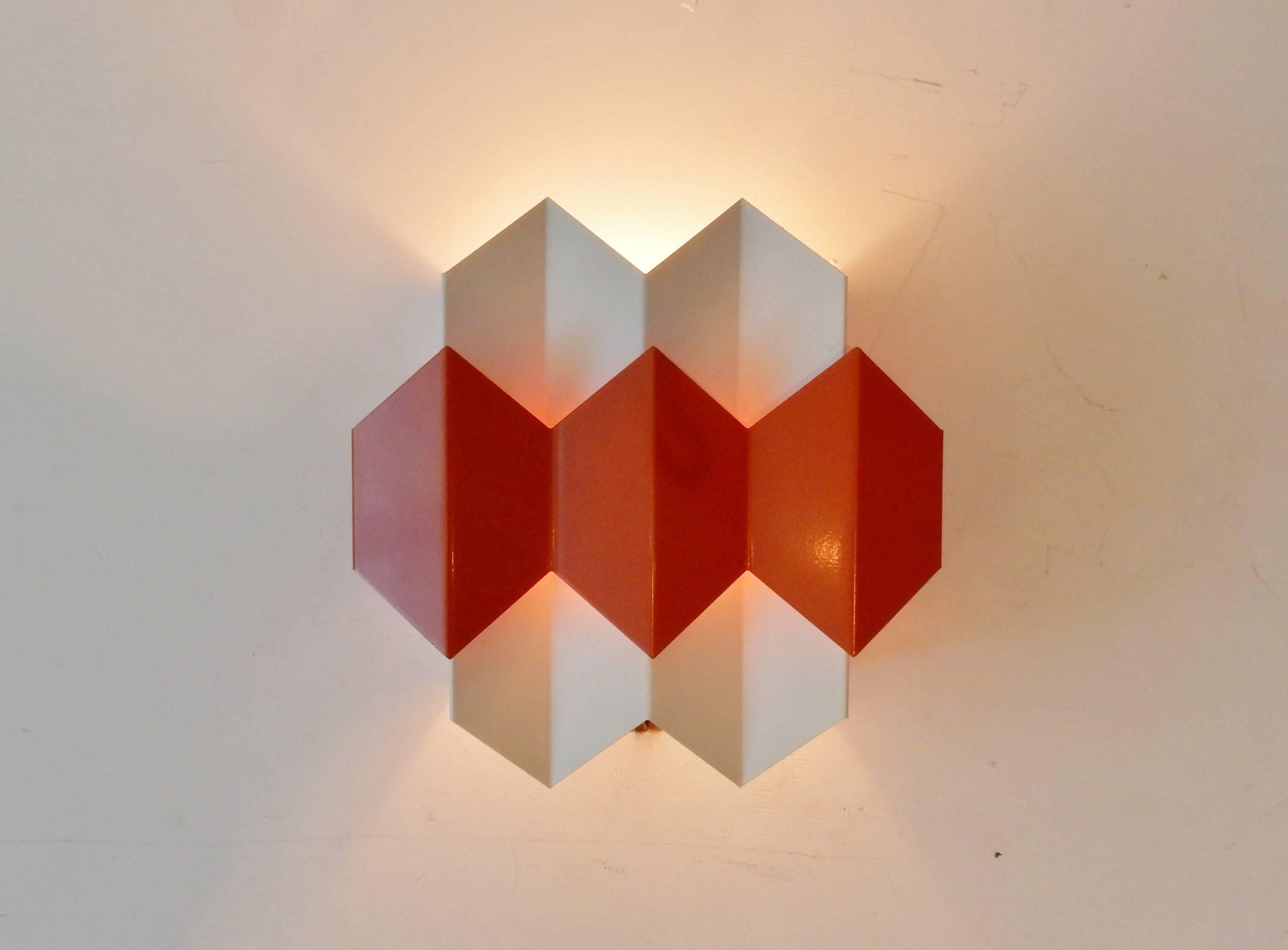 These wall lights are quite rare to come by. With the playfulness of the colors and Bent Karlby as a major designer for Lyfa, these could very likely be from his hand. Although Simon Henningsen and Ole Panton come to mind as well. All four are in a
