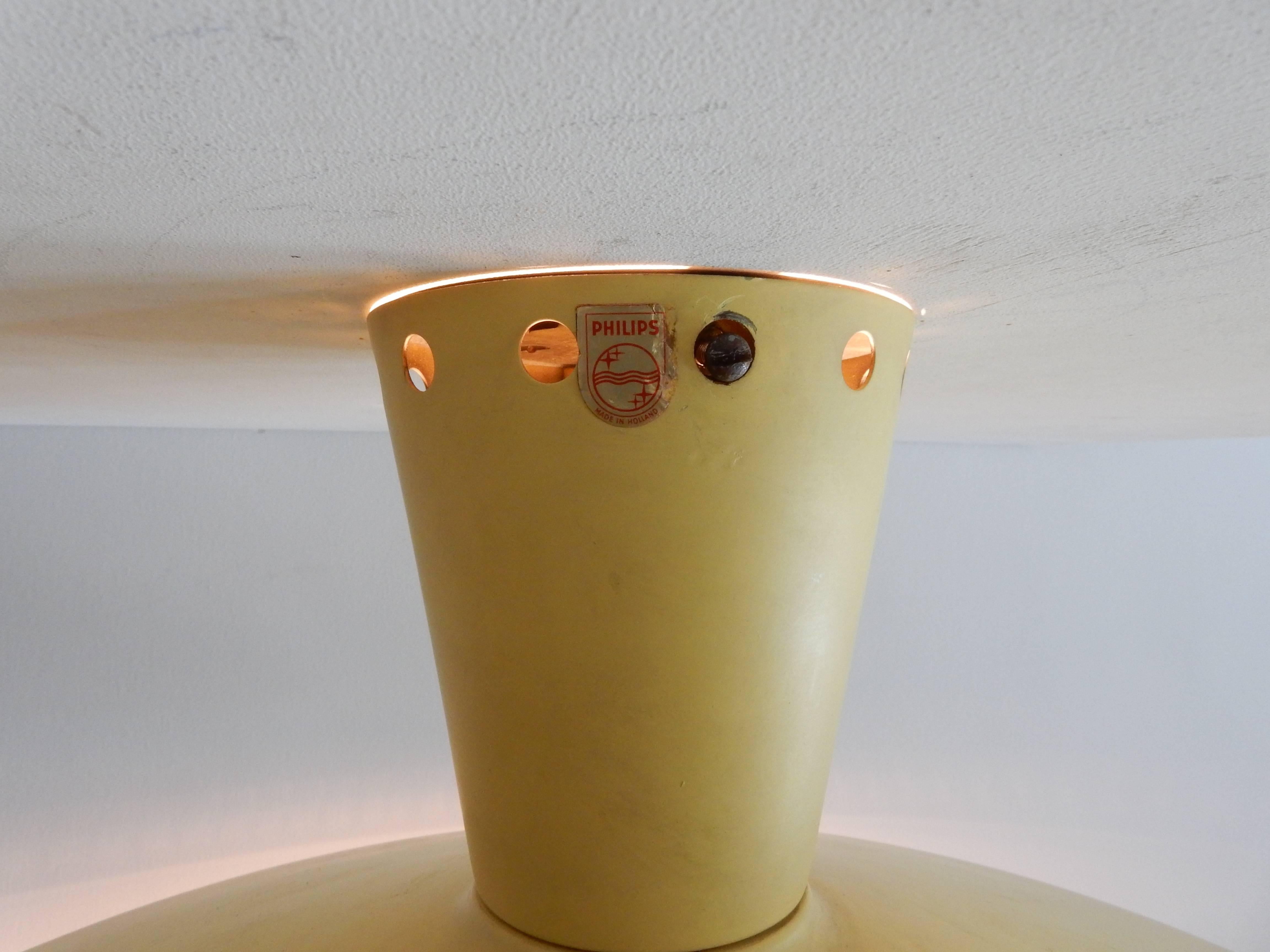Probably the most famous industrial ceiling light from the Netherlands. A design by Louis Christiaan Kalff for Philips, designed in the late 1950s. This model is cataloged as model NB93 E/00. The E/00 represents the color. This light was available