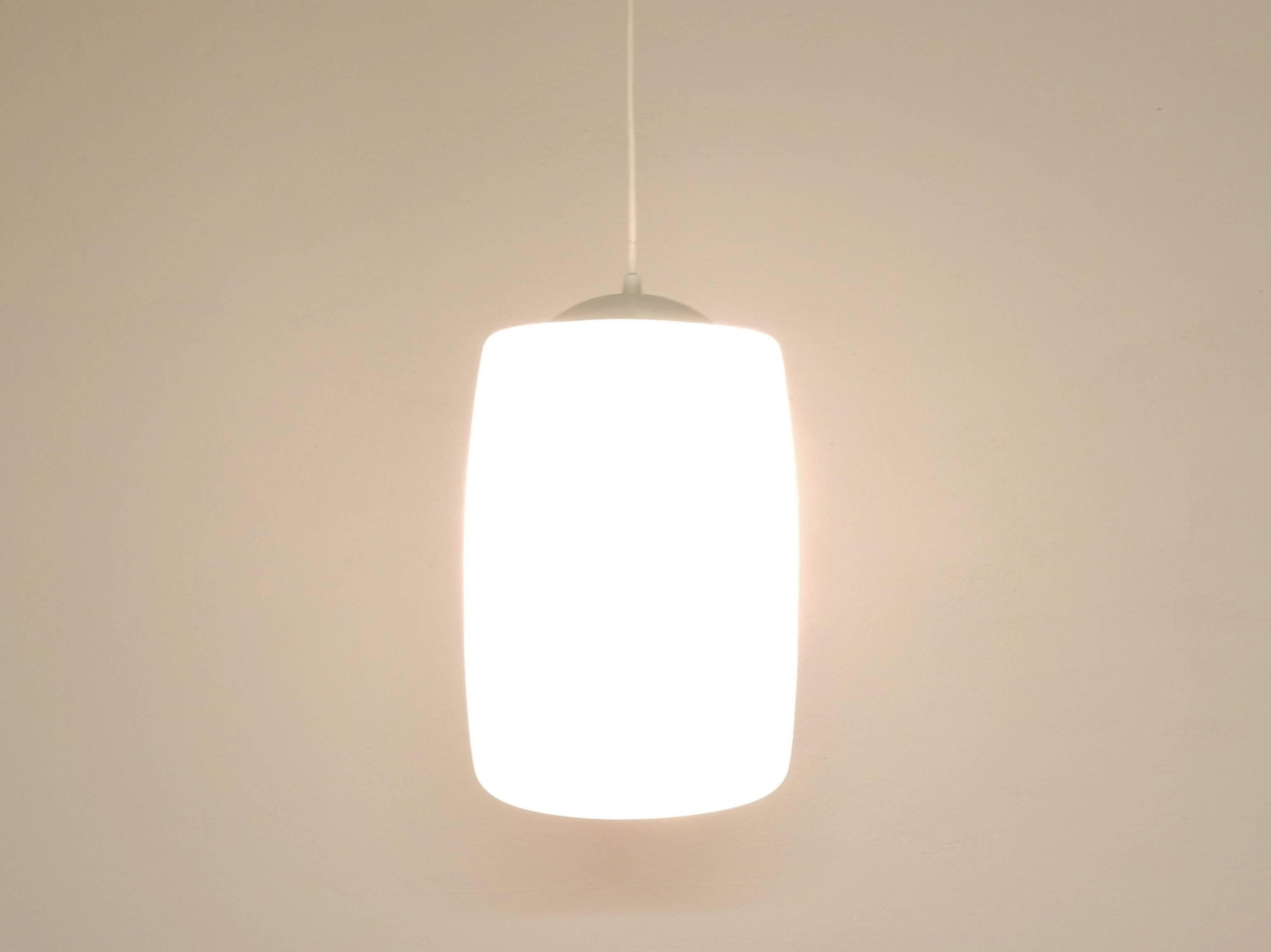 We have 42 of these glass pendant lights available from a church building from the Netherlands. With a purchase of more more lights (7+) we can include the original canopy and fixtures that will allow you to group up to 7 lights.

All lights are