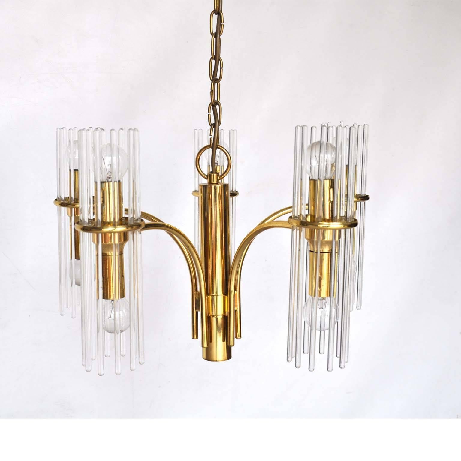 Chandelier designed by Geatano Sciolari.

This chandelier is made of brass with glass rods. When on, the rods diffuse the light of the bulbs which gives a beautiful effect.

In original condition. Four rods have been replaced.

Marked with a