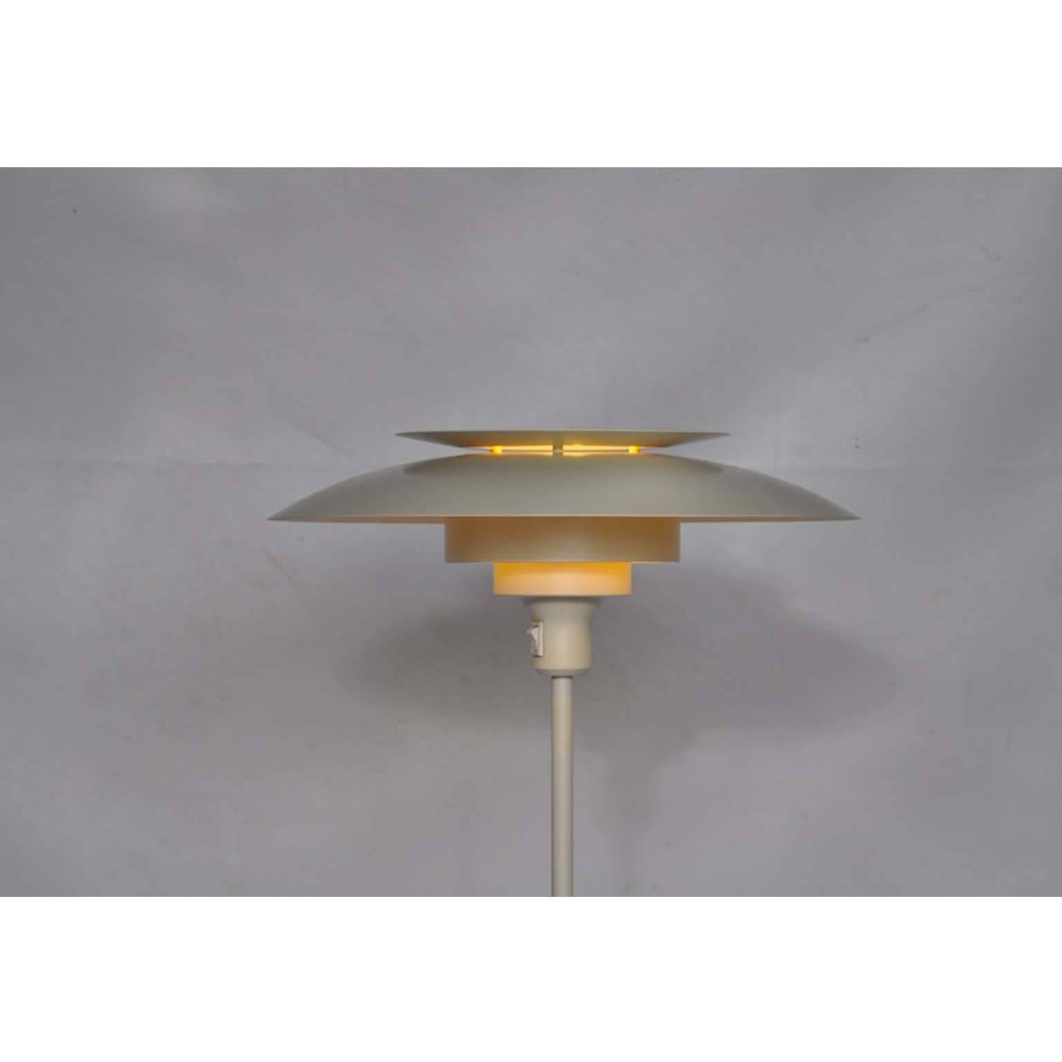 White metal Danish floor lamp by the son of the famous Poul Henningsen, Simon Henningsen for Lyskaer. Marked under the lamp shade.

All our lights are checked and tested. Because of the lower voltage standard in the USA (110v vs 220v), European