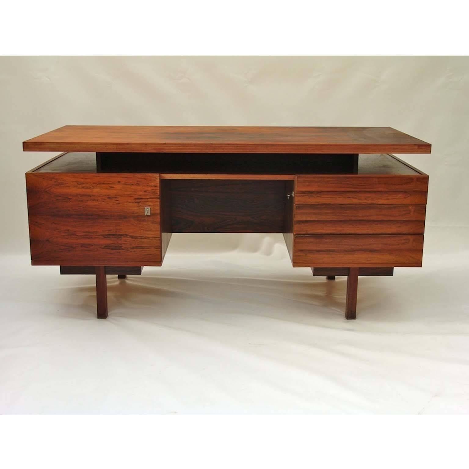 Danish rosewood desk. Very heavy. Unfortunately we do not know the designer or manufacturer.