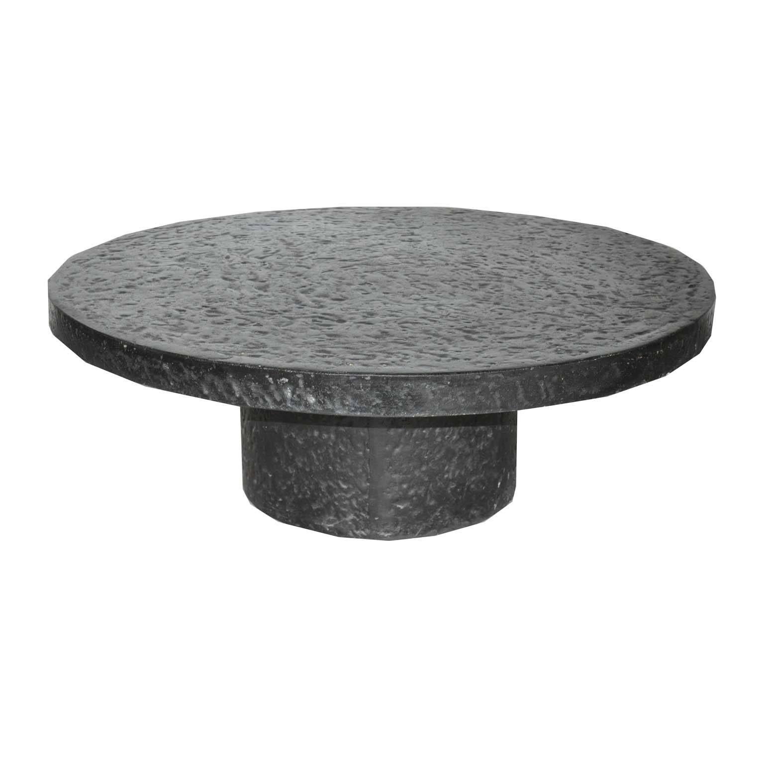 Black Brutalist coffee table in the style of Ado Chale. Made in the 1970s, France.

The table has an interesting structure. It is made of molded graphite stone and resin. This unique process, gives it its beautiful rough, brutalist