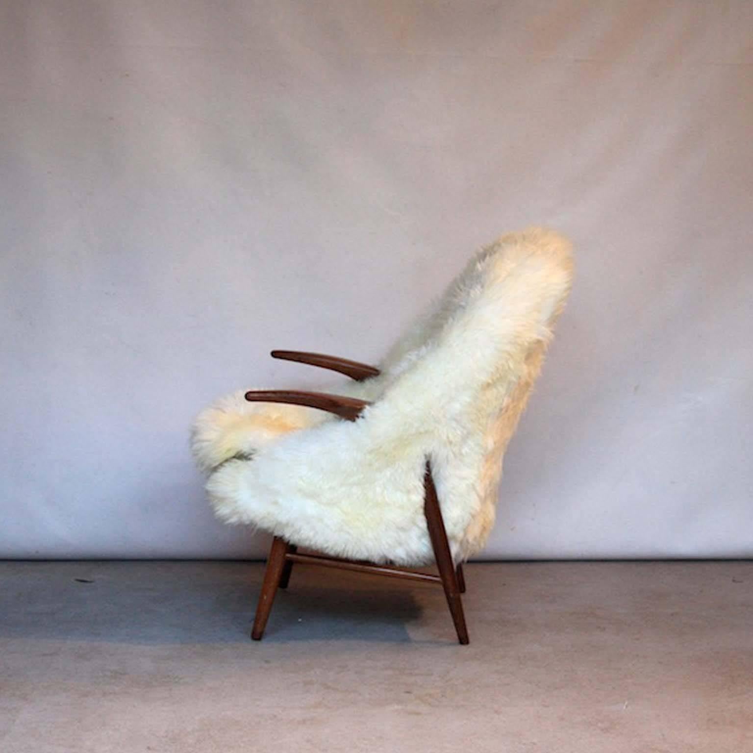 Scandinavian Modern Danish Teak Lounge Chair in Sheepskin, Denmark, 1960s For Sale