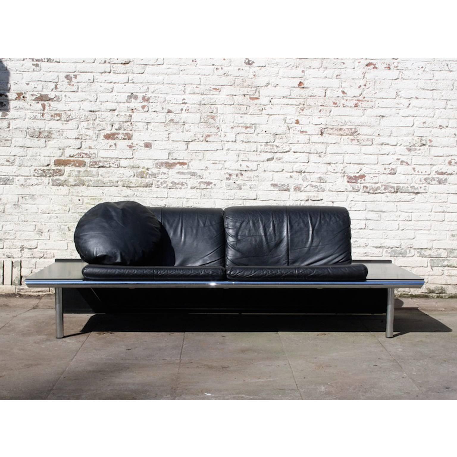 Harvink Mission sofa. Black wooden frame with metal legs and black leather cushions. 

Width: 200cm
Depth: 88 cm; seating 56cm
Height back: 68cm; seating: 43cm
Height table: 32cm.