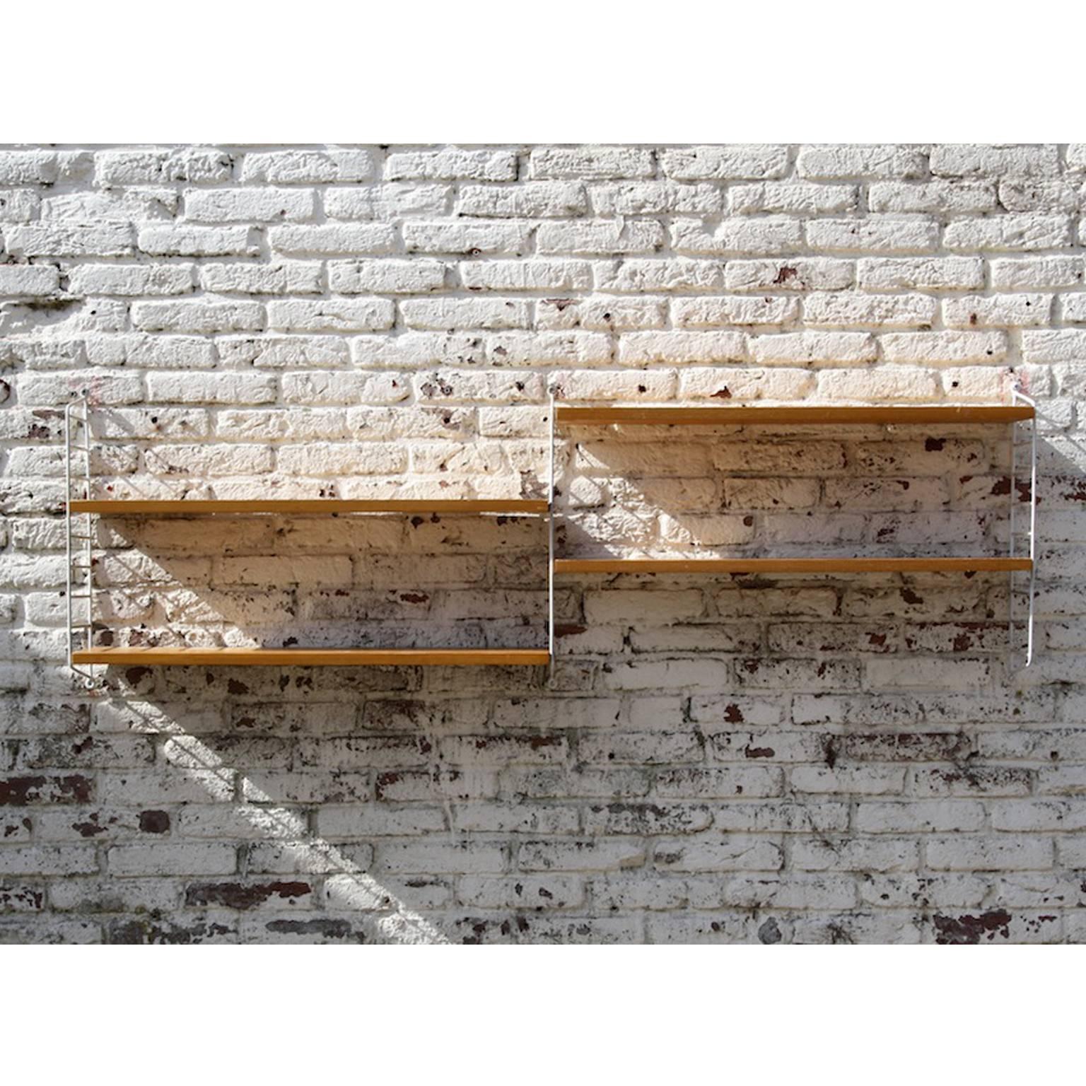 Minimalistic shelving system by Nils “Nisse” strinning for string, Sweden, 1949 pinewood

This shelving system with its Minimalistic looks, was designed by Swedish architect Nils “Nisse” and his wife Kajsa strinning in 1949. With its modular