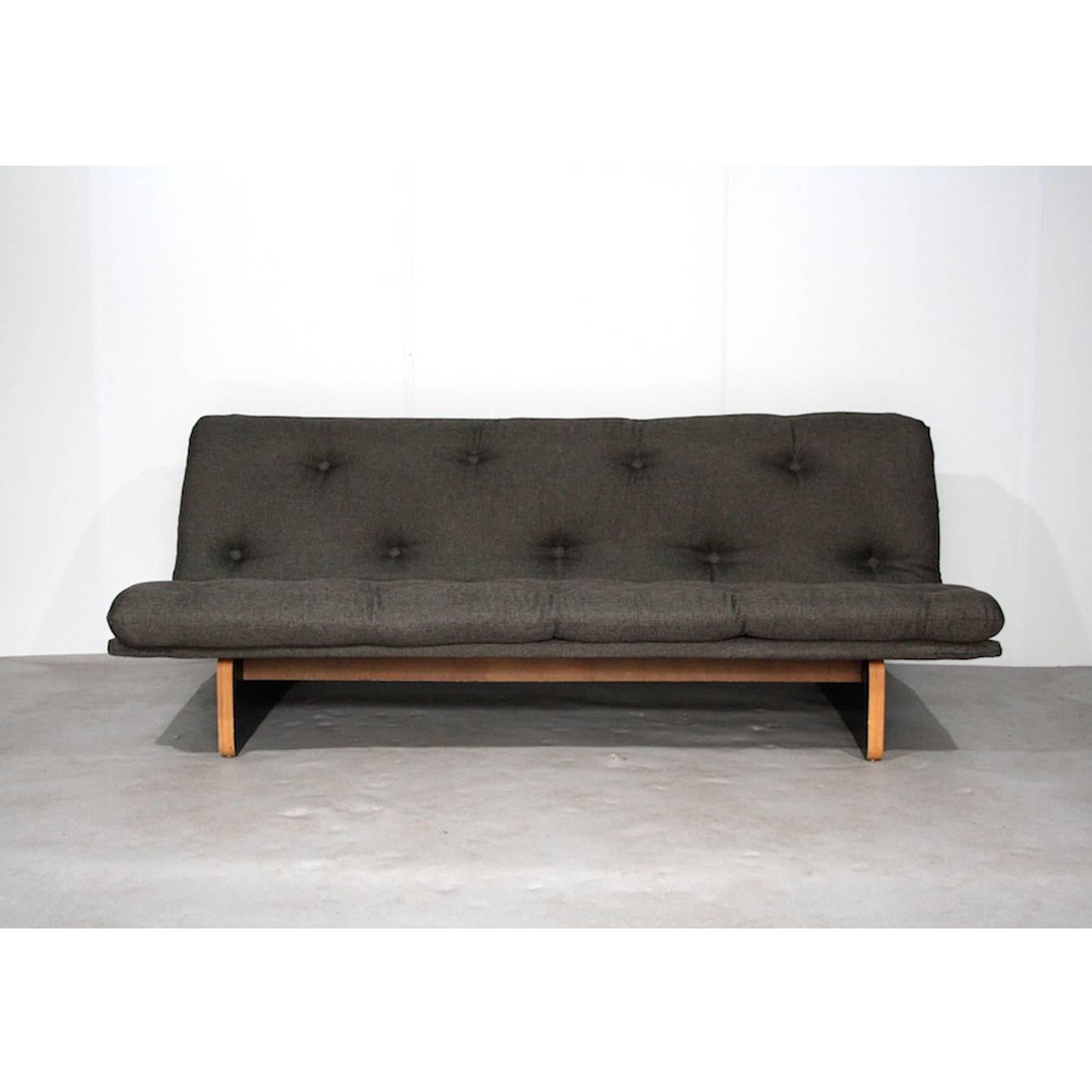 Nice sofa from Artifort designed by Kho Liang Ie. This is the more rare version with the wooden base instead of the metal base (C683). Frame of pressed beech upholstered with moulded foam. With integrated loose seat with new dark army green-grey